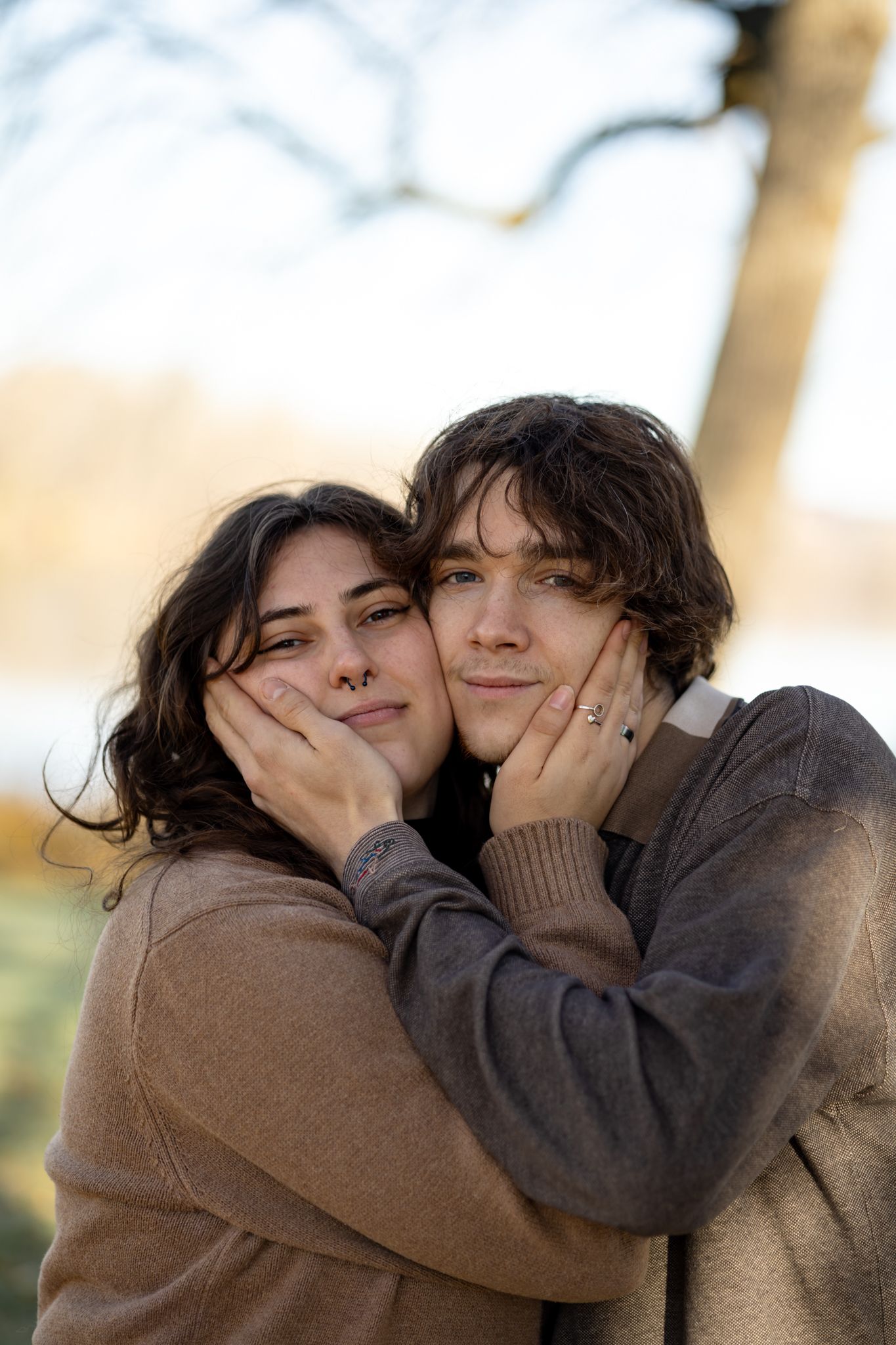 A playful sequence of affectionate moments captured outdoors in warm autumn lighting.