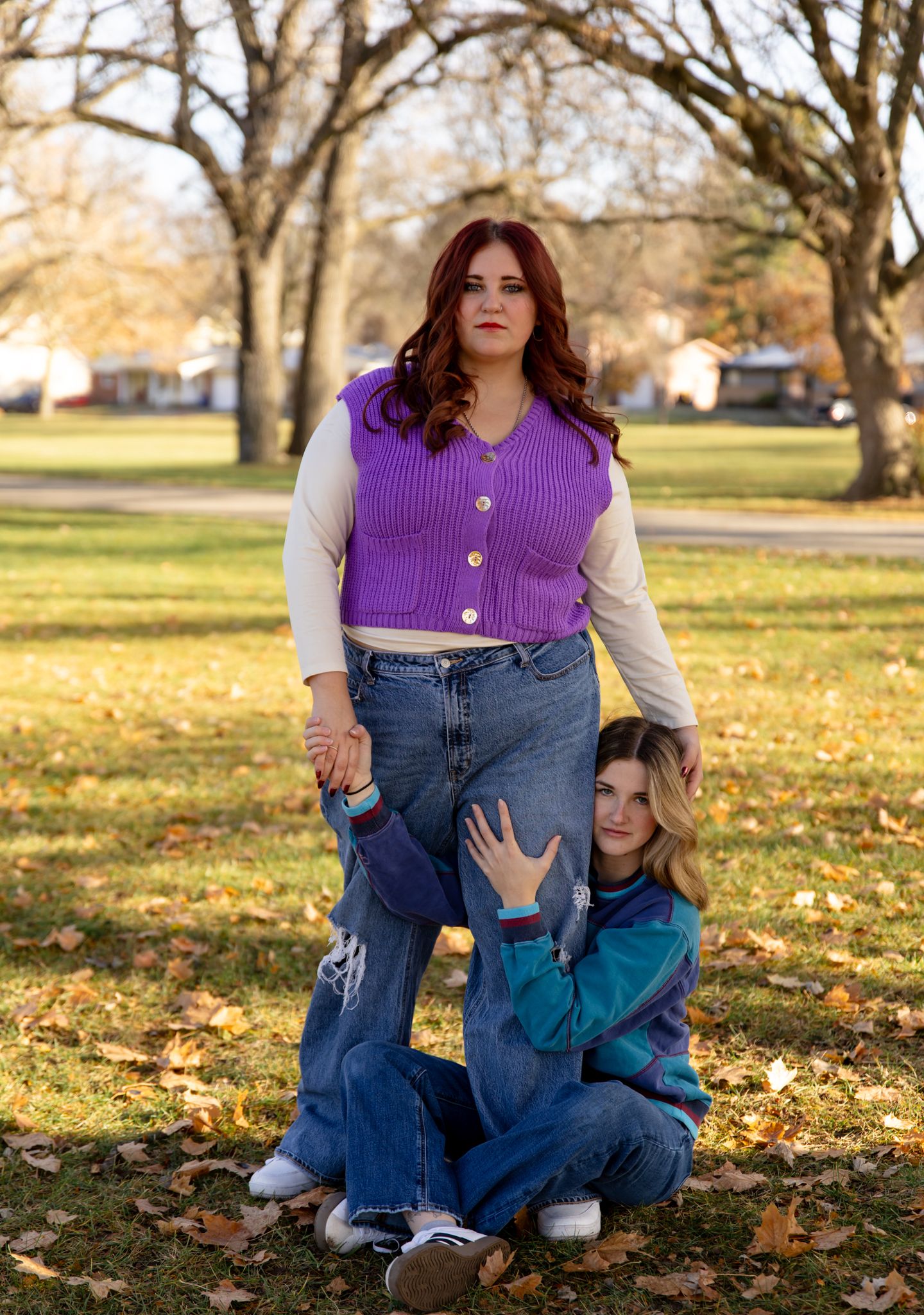 Candid moments in an autumn park setting with people in casual denim and purple attire.