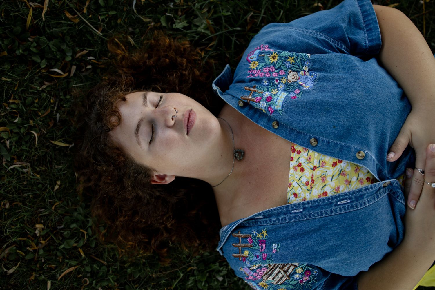 Creative portrait series in denim against natural outdoor backdrop.