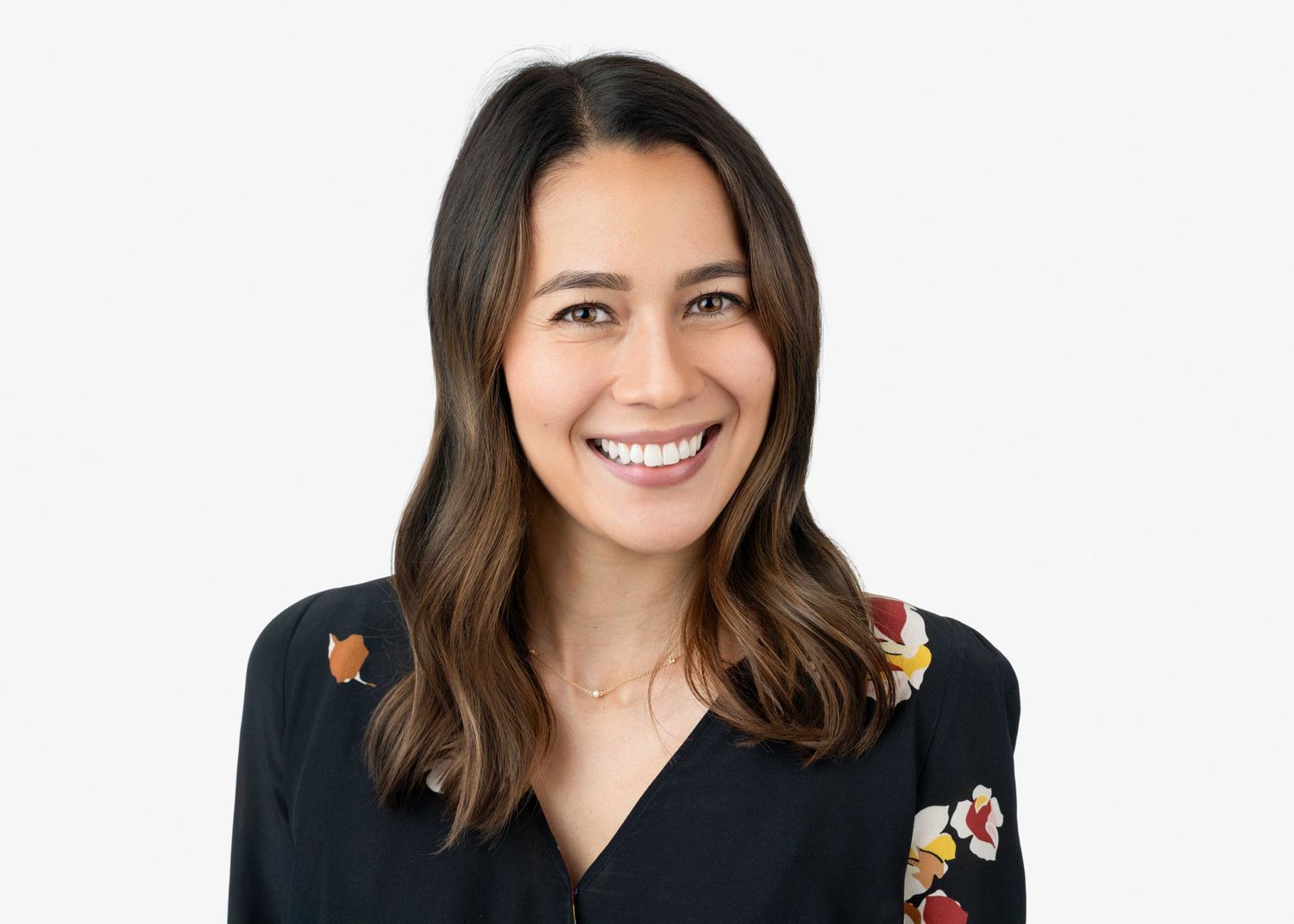 Female professional headshot taken in studio environment.