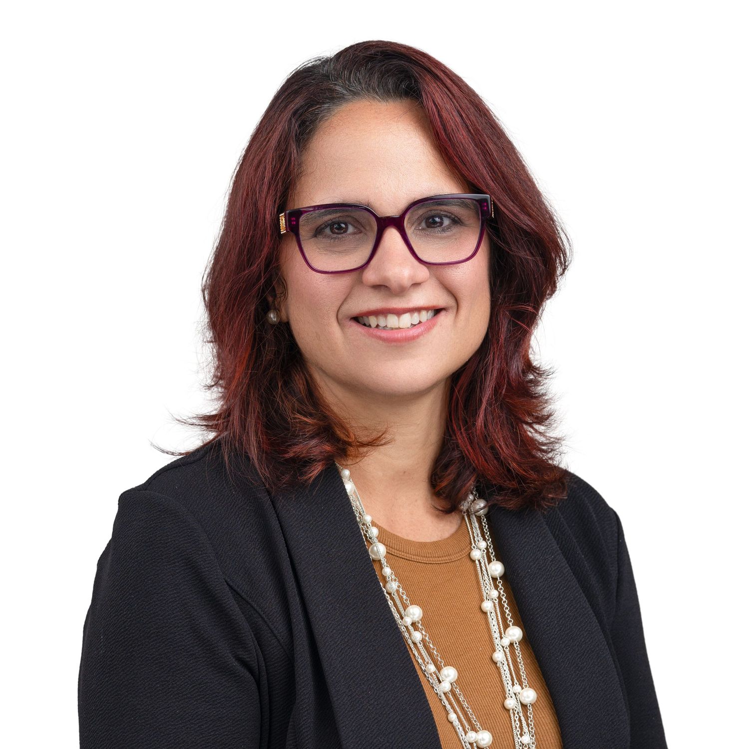 Women with wearing red glasses posed for a traditional headshot agains a white background.