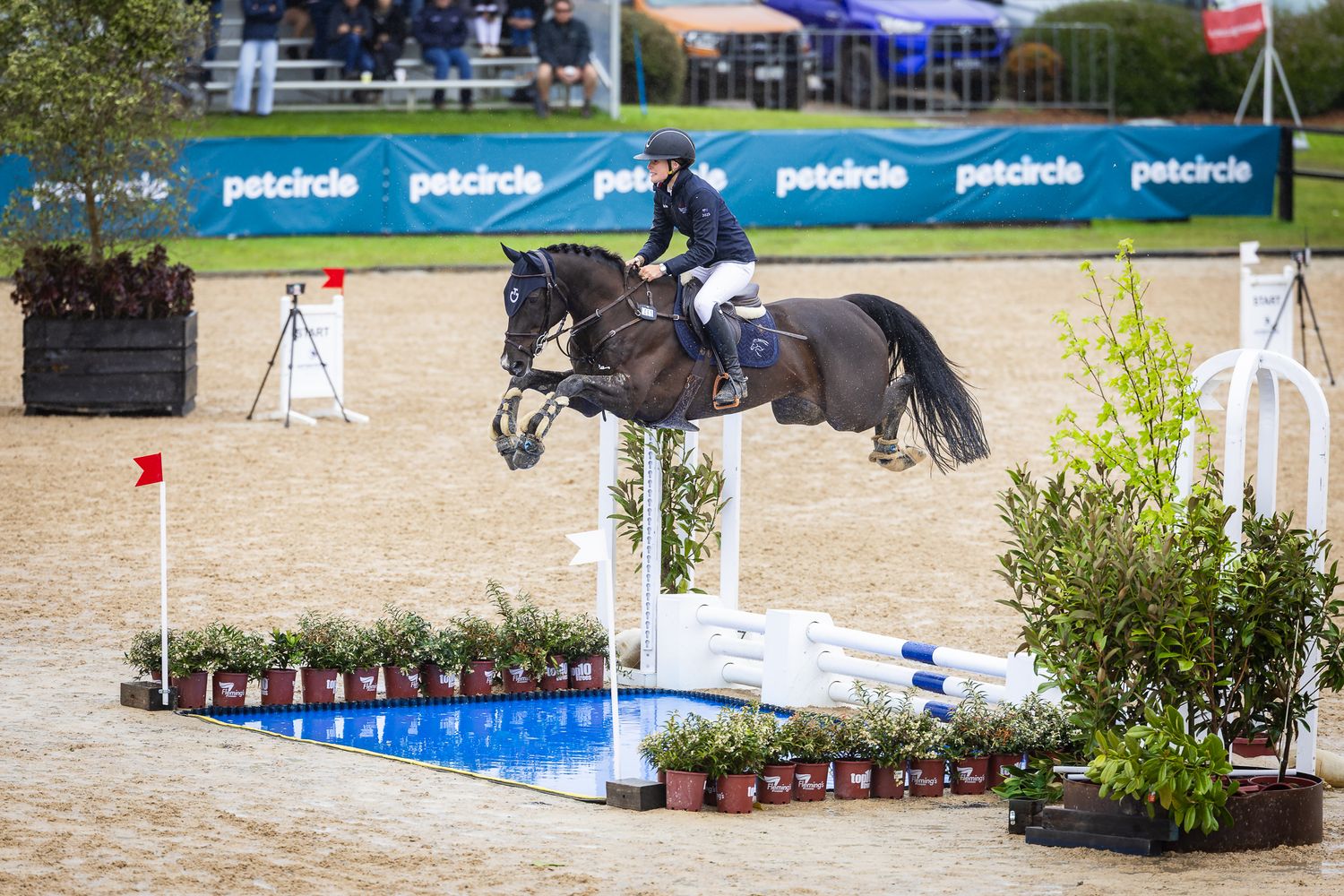 Ella Pitts and Valentino soar over the water jump at the 2025 Australian Jumping Championships at Boneo Park. © Simon Scully, 2025.
