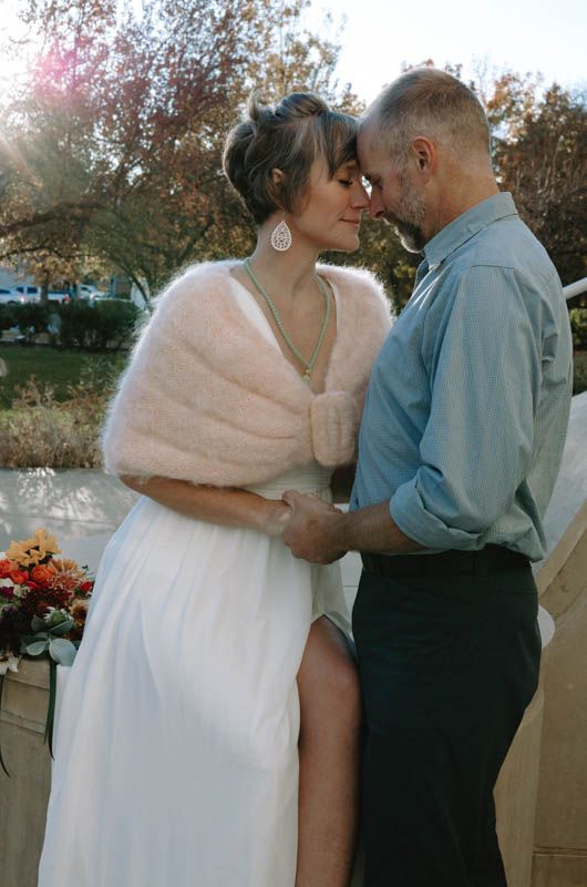 Intimate dance sequence captured during golden hour with autumn trees in background.