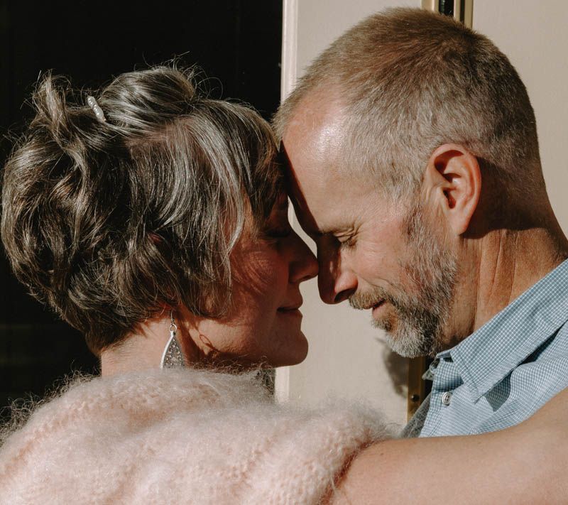 An intimate close-up of a couple sharing a tender moment together.