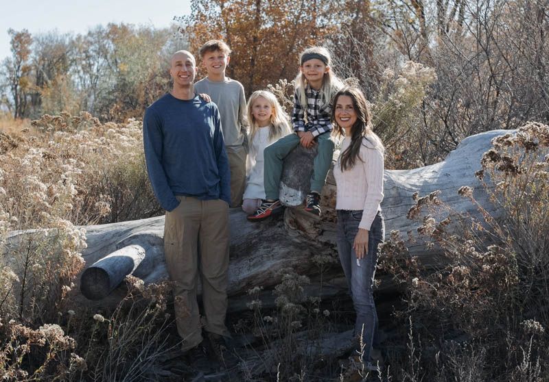 A group photo of family members posing together on Connected Lakes, Grand Junction, Colorado.
