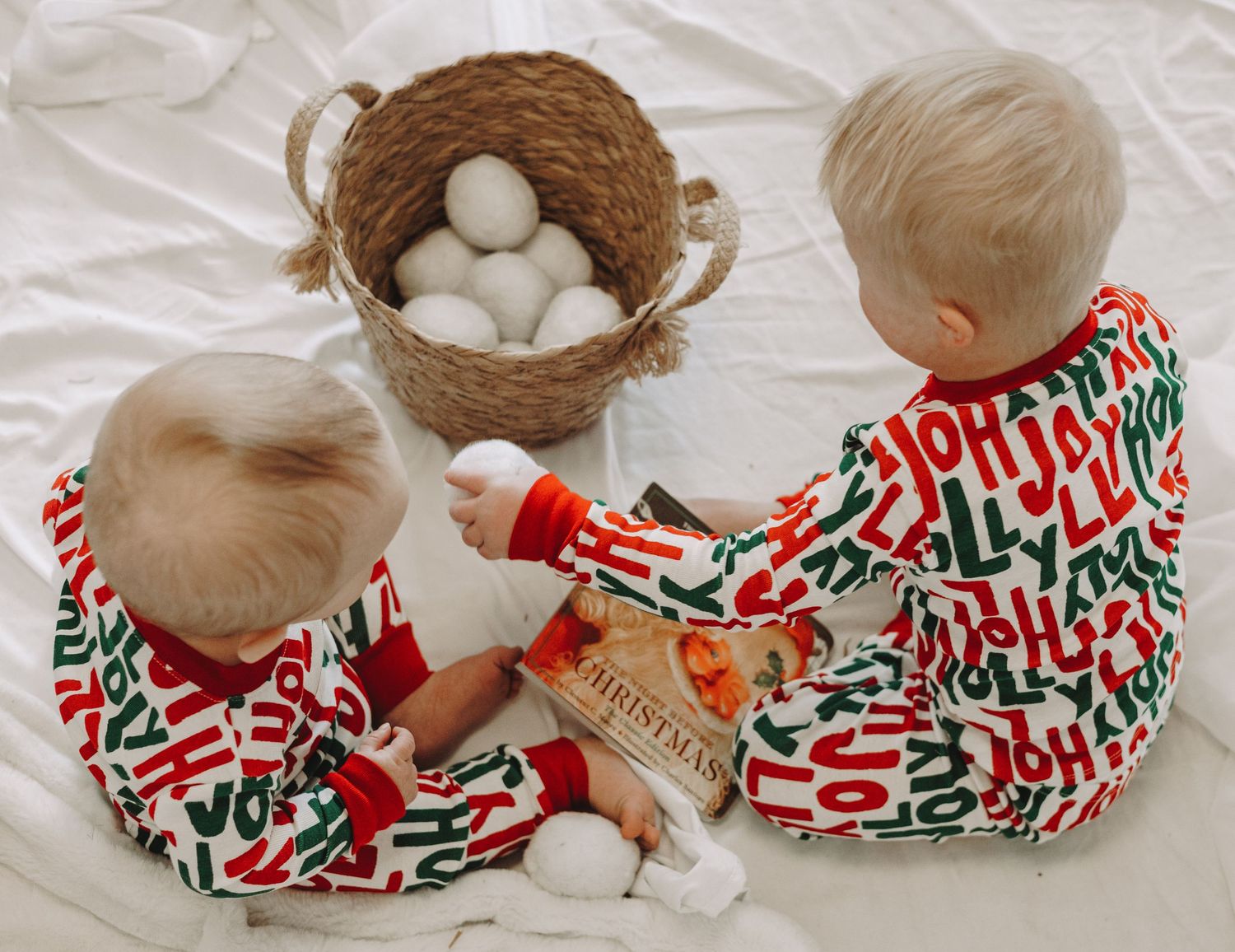 A creative collage showcasing winter holiday family portraits against a light-colored backdrop with evergreen trees.