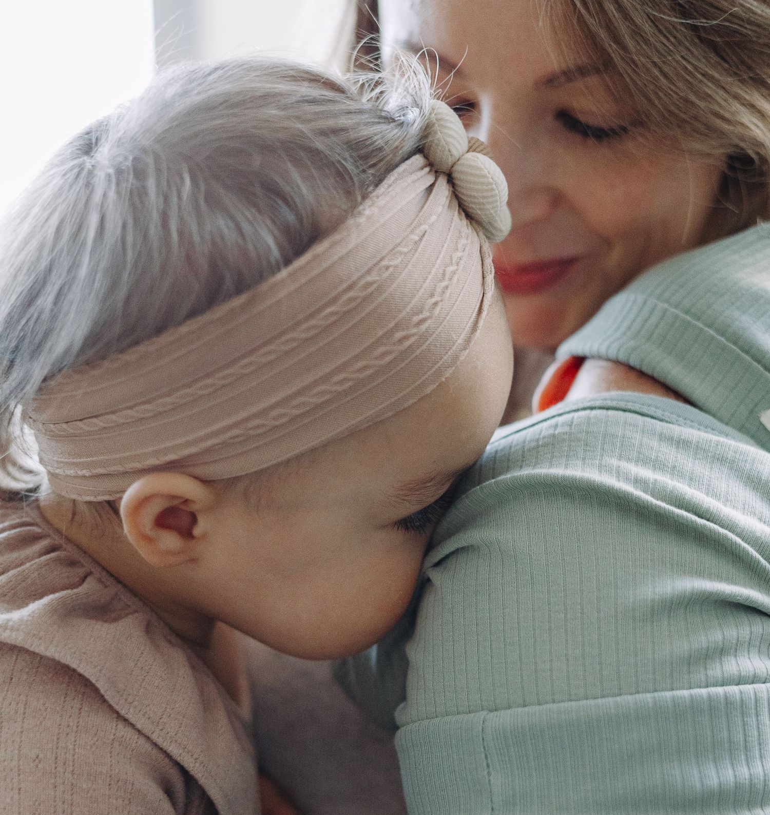 A tender moment shows emotional affection and closeness between two people embracing.