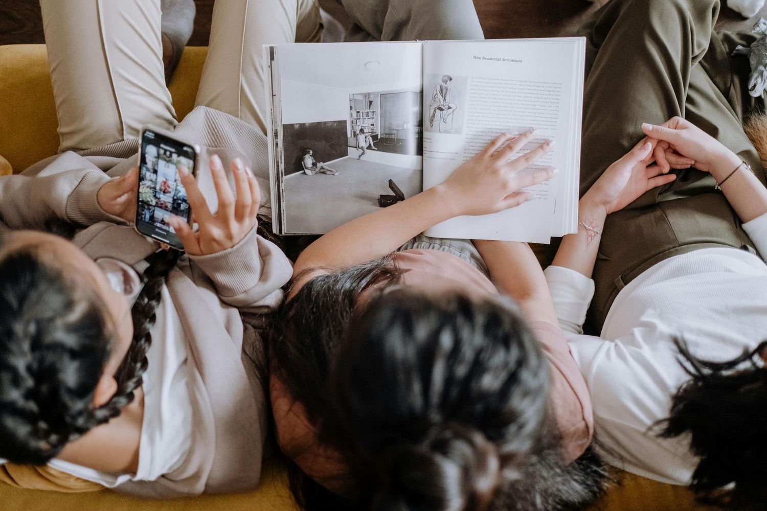 A collage showing someone using their smartphone while relaxing on a light colored couch or sofa.