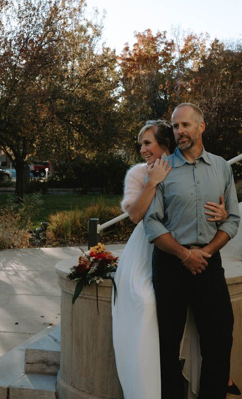 Dancing couple photographed in sequence against fall foliage background.