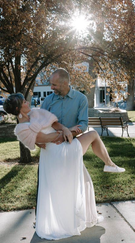 Romantic dance sequence in a park with sunlight streaming through autumn trees.