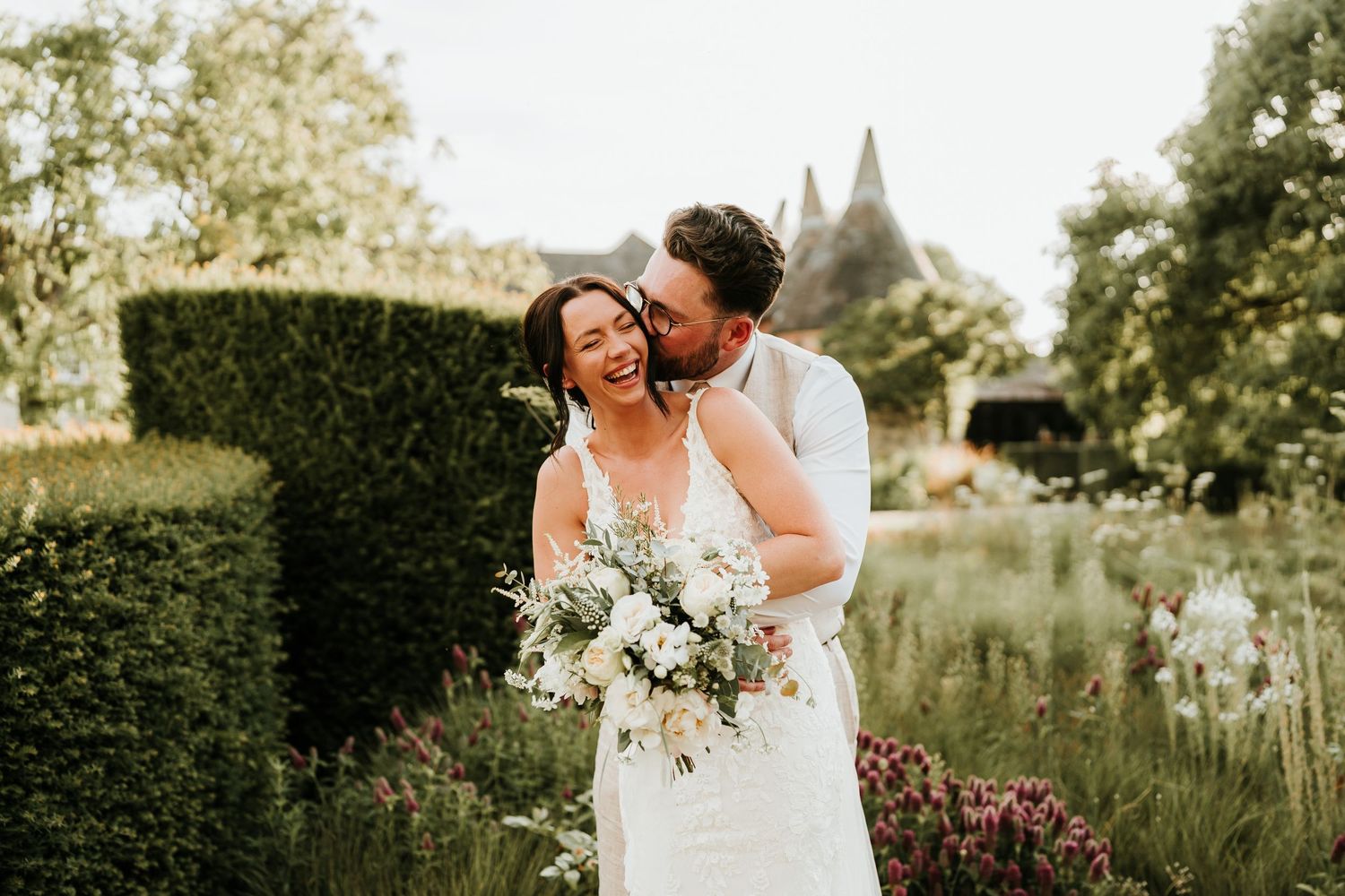 Relaxed wedding photography of confetti moment at Bury Court Barn in Surrey.