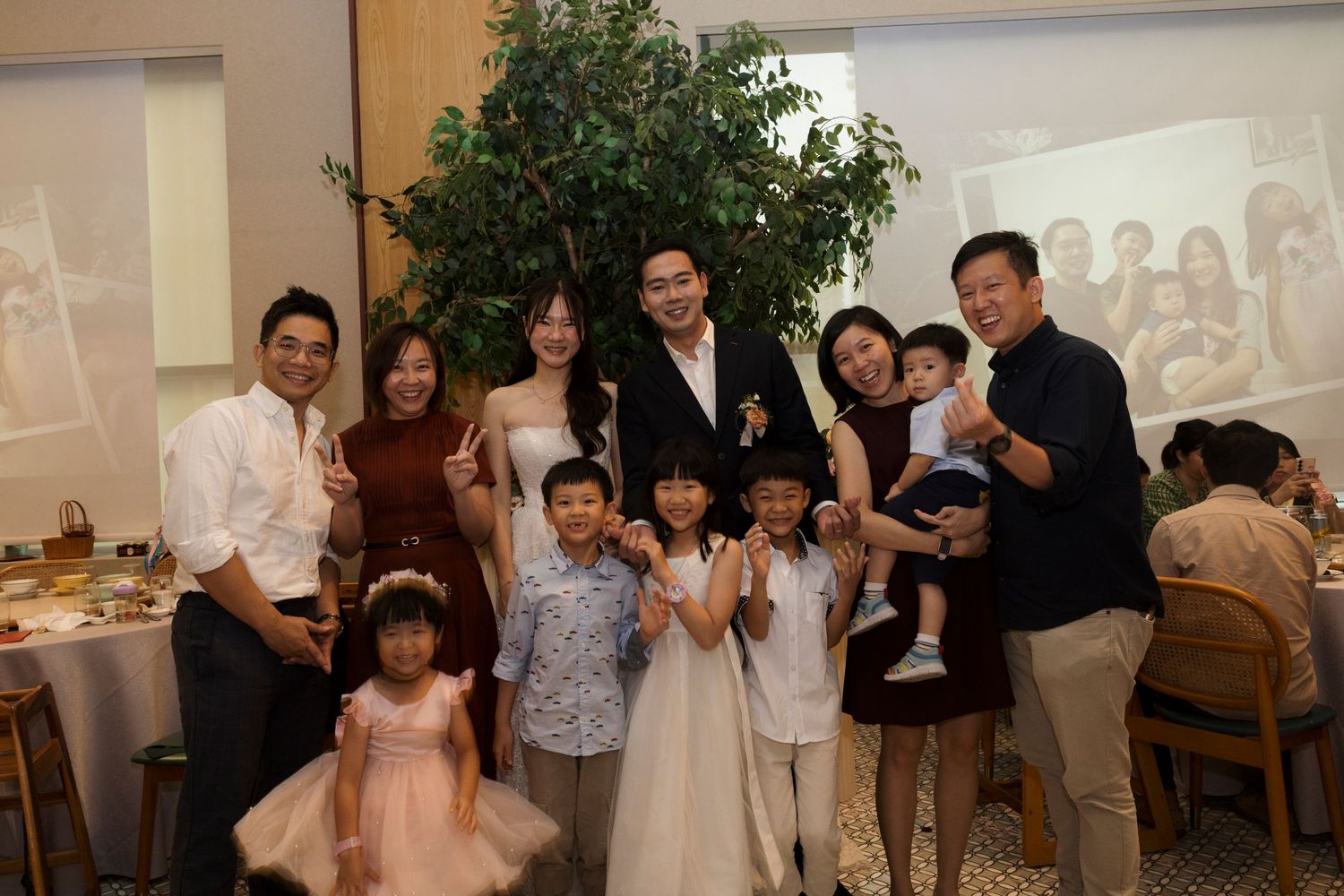 Family group photo at a wedding banquet in Singapore