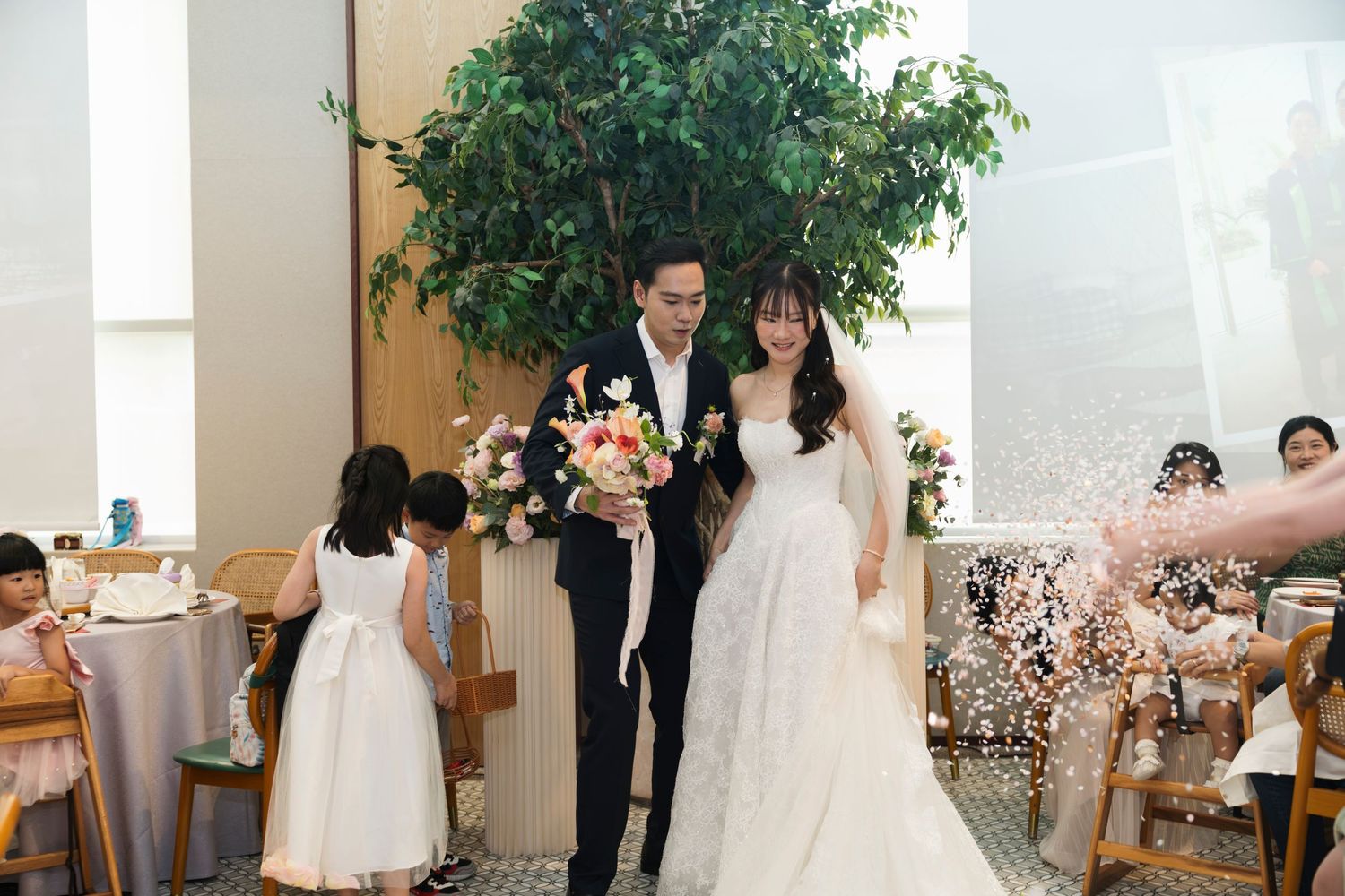 Bride and groom walking in at their wedding banquet in Singapore, actual day wedding photography