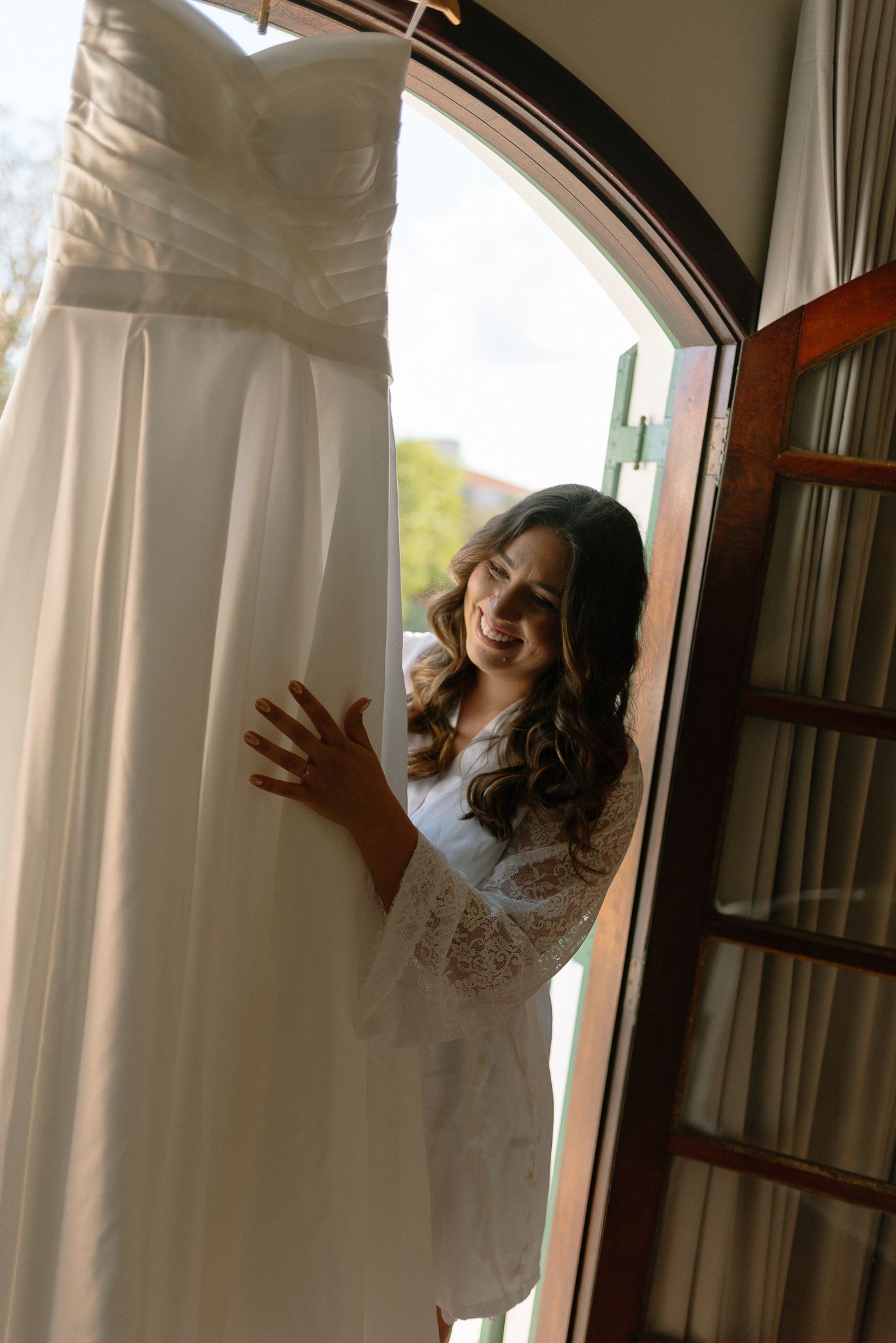 Wedding dress preparation sequence showing details and adjustments.