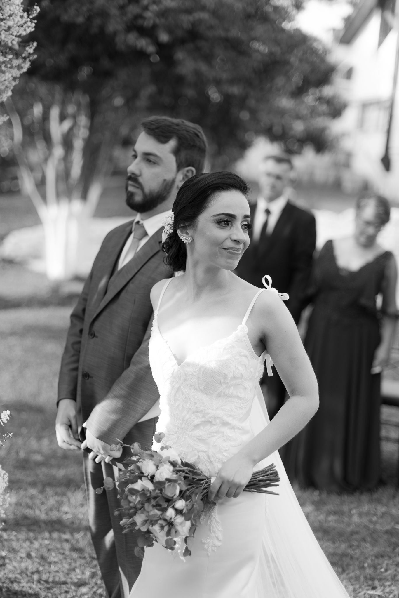 Black and white wedding photography capturing candid moments during ceremony.