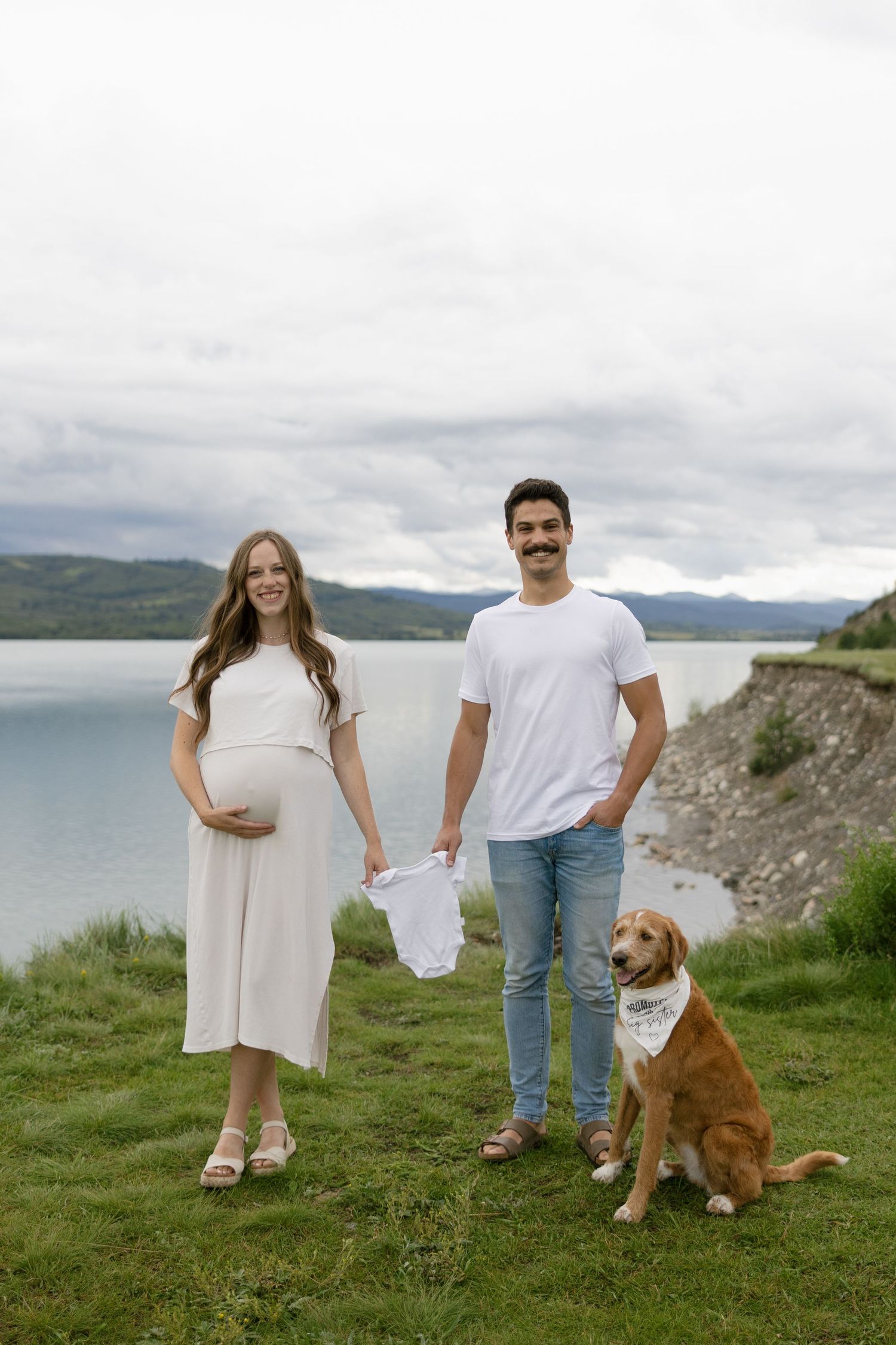 Ghost Lake Alberta family photography, expecting couple enjoying outdoor maternity session with dog