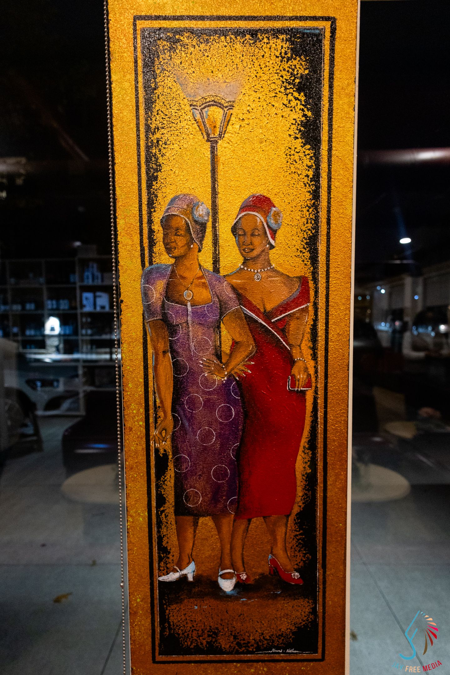 Elegant painting of two women in vintage dresses standing under a street lamp on a golden textured background.