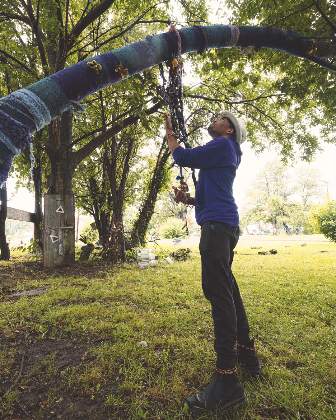 A series showing athletic movements on parallel bars against a backdrop of green trees.