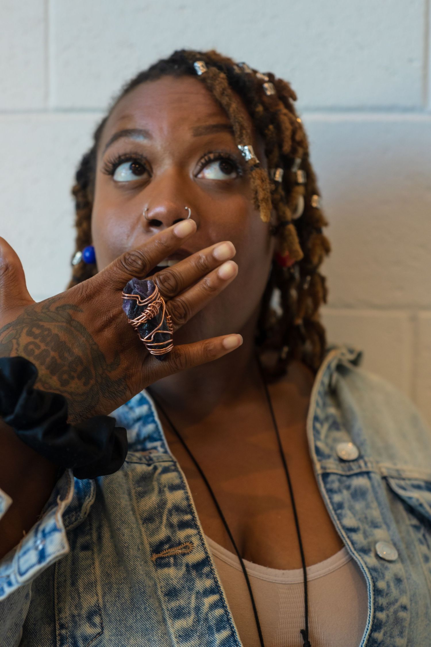 Fashion portrait series showing artistic poses and jewelry details.