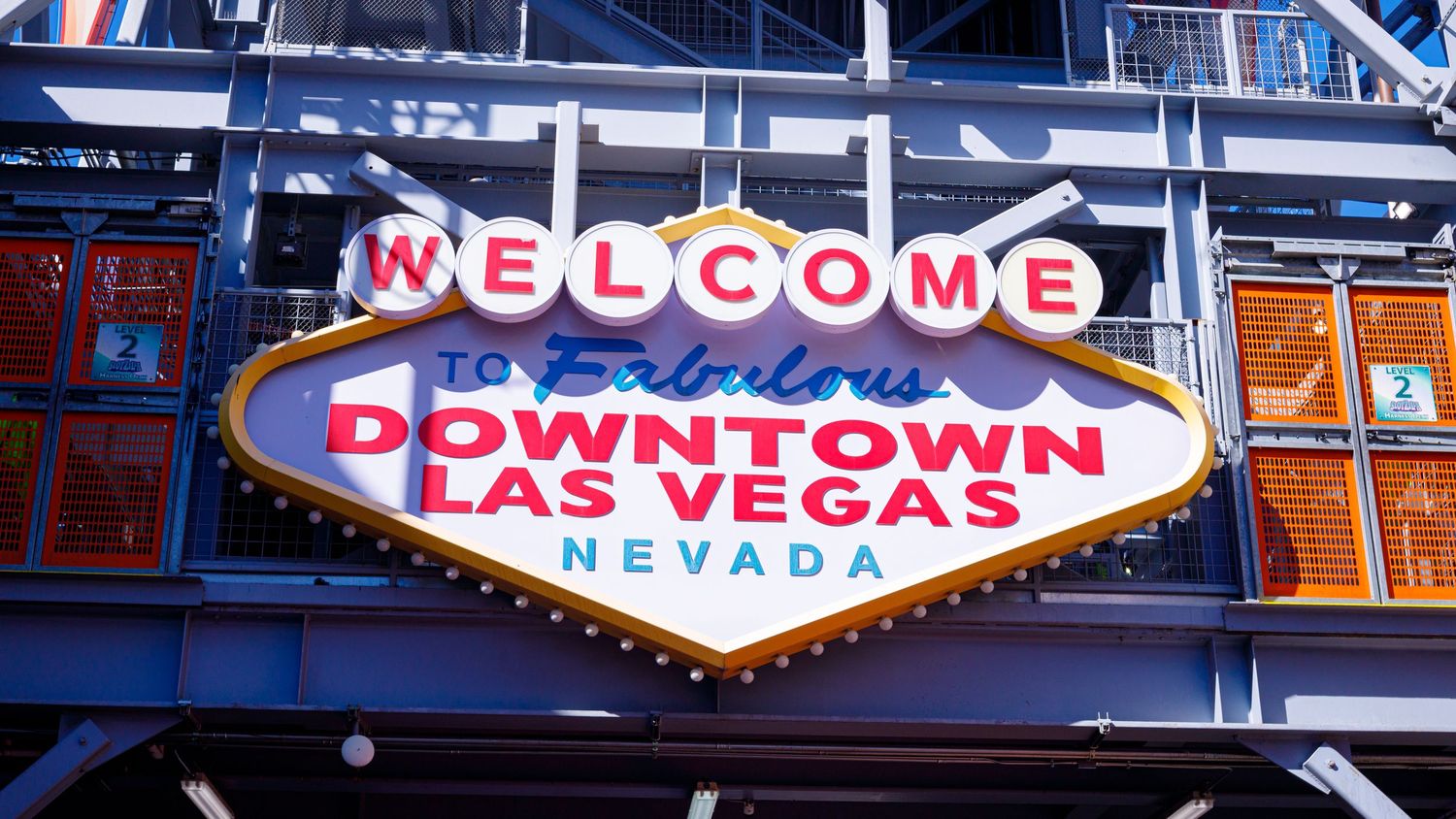 Welcome to Fabulous Downtown Las Vegas Nevada iconic illuminated sign against a blue sky.