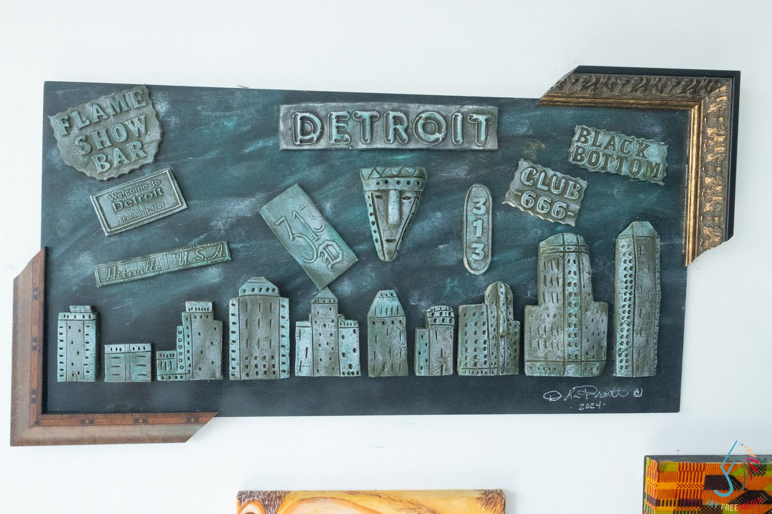 3D Detroit cityscape wall art featuring iconic venues in metallic tones.