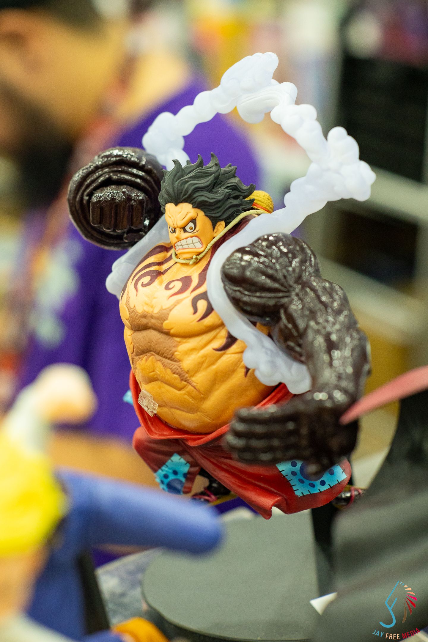 One Piece Monkey D. Luffy Gear Fourth anime figure in dynamic battle pose with black fist and smoke effects.