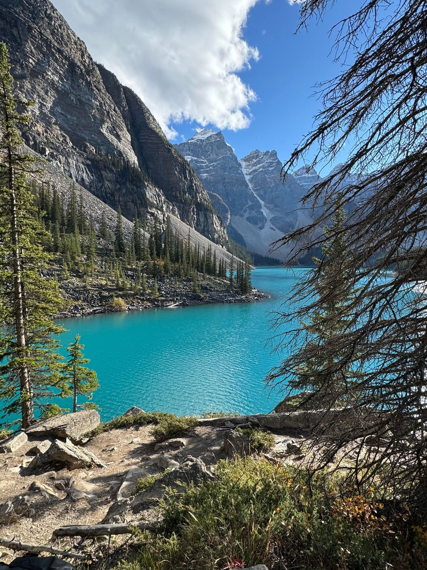 Turquoise waters of Moraine Lake surrounded by rocky mountain peaks in Banff National Park.