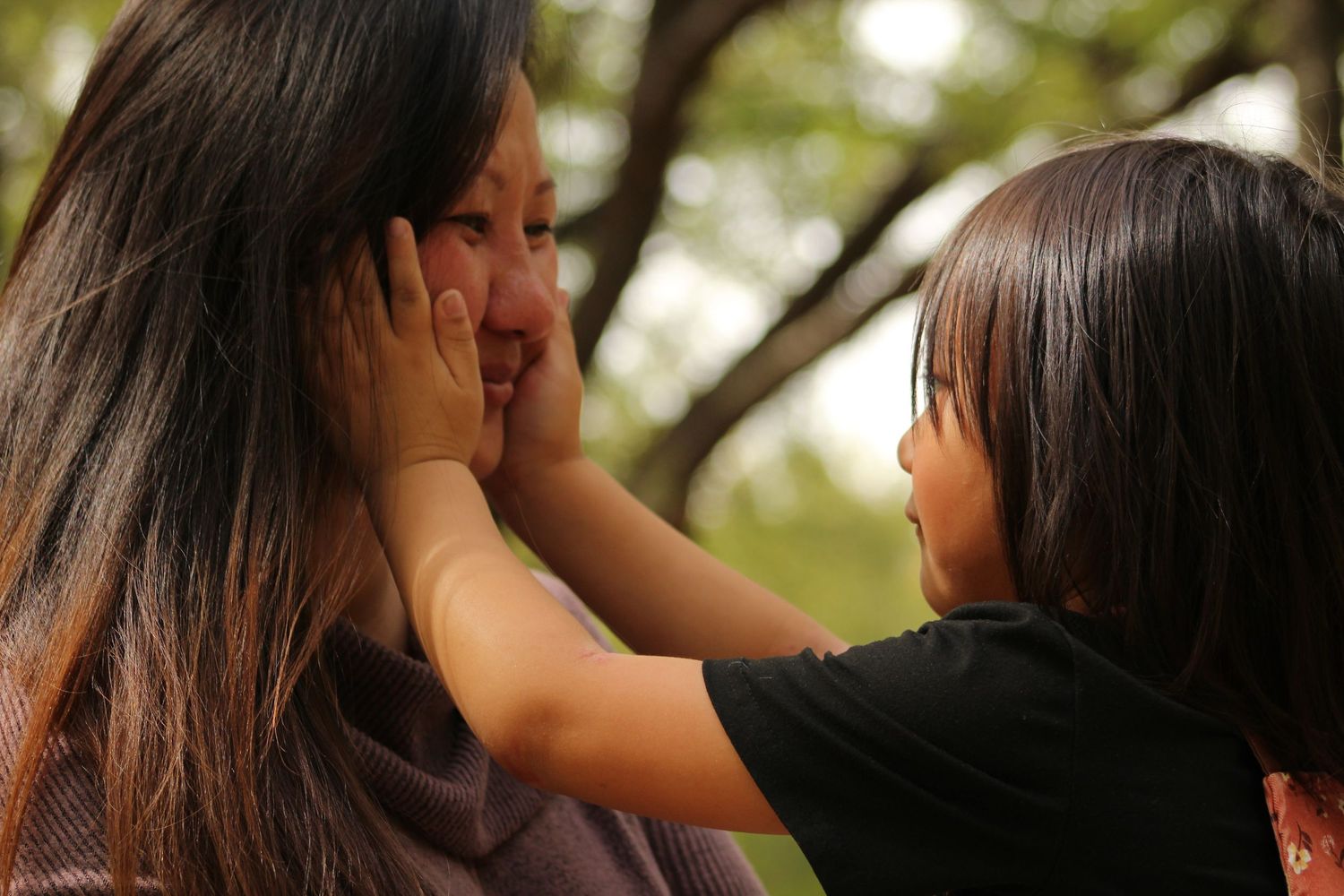 Close-up sequence of intimate interactions between friends in natural lighting.