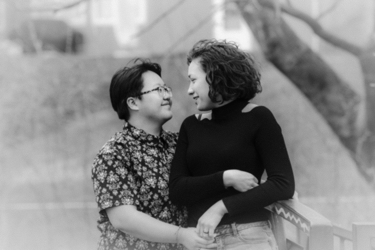 Black and white romantic portrait of a couple embracing.