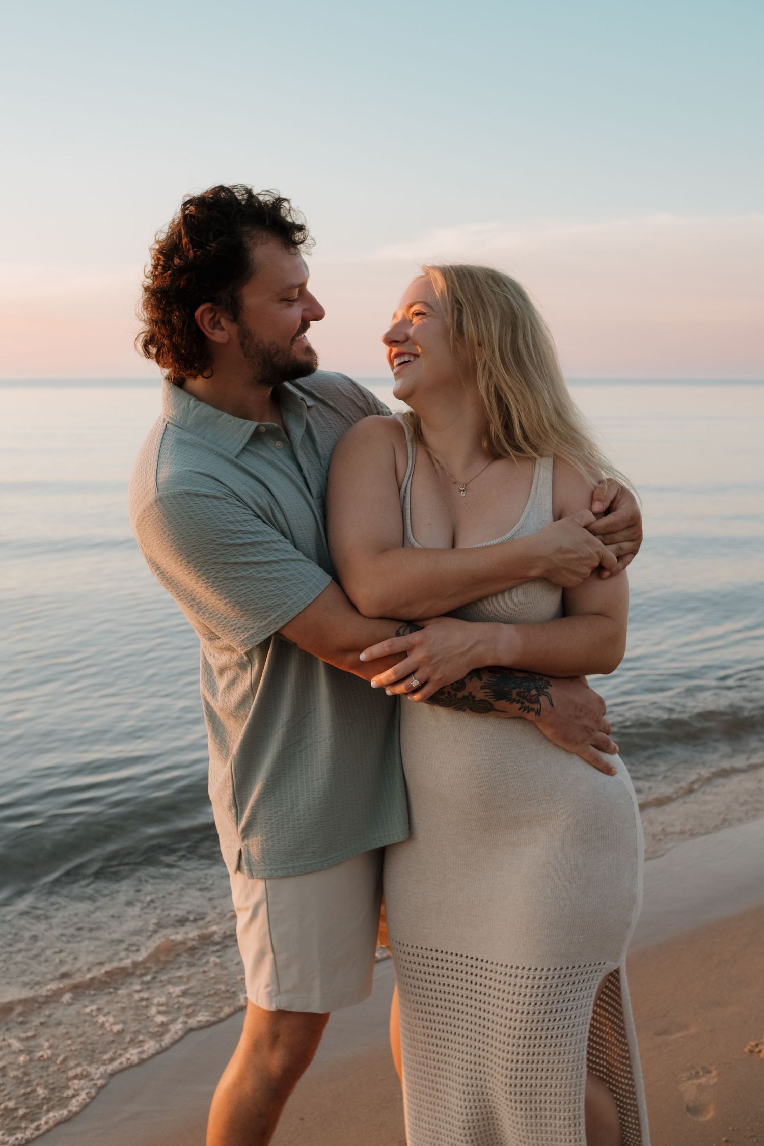 Couple hugging during engagement session in Racine WI