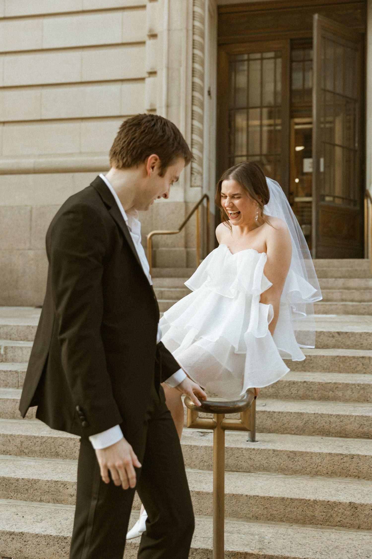 Playful wedding photo sequence showing couple dancing and moving on outdoor stone steps.