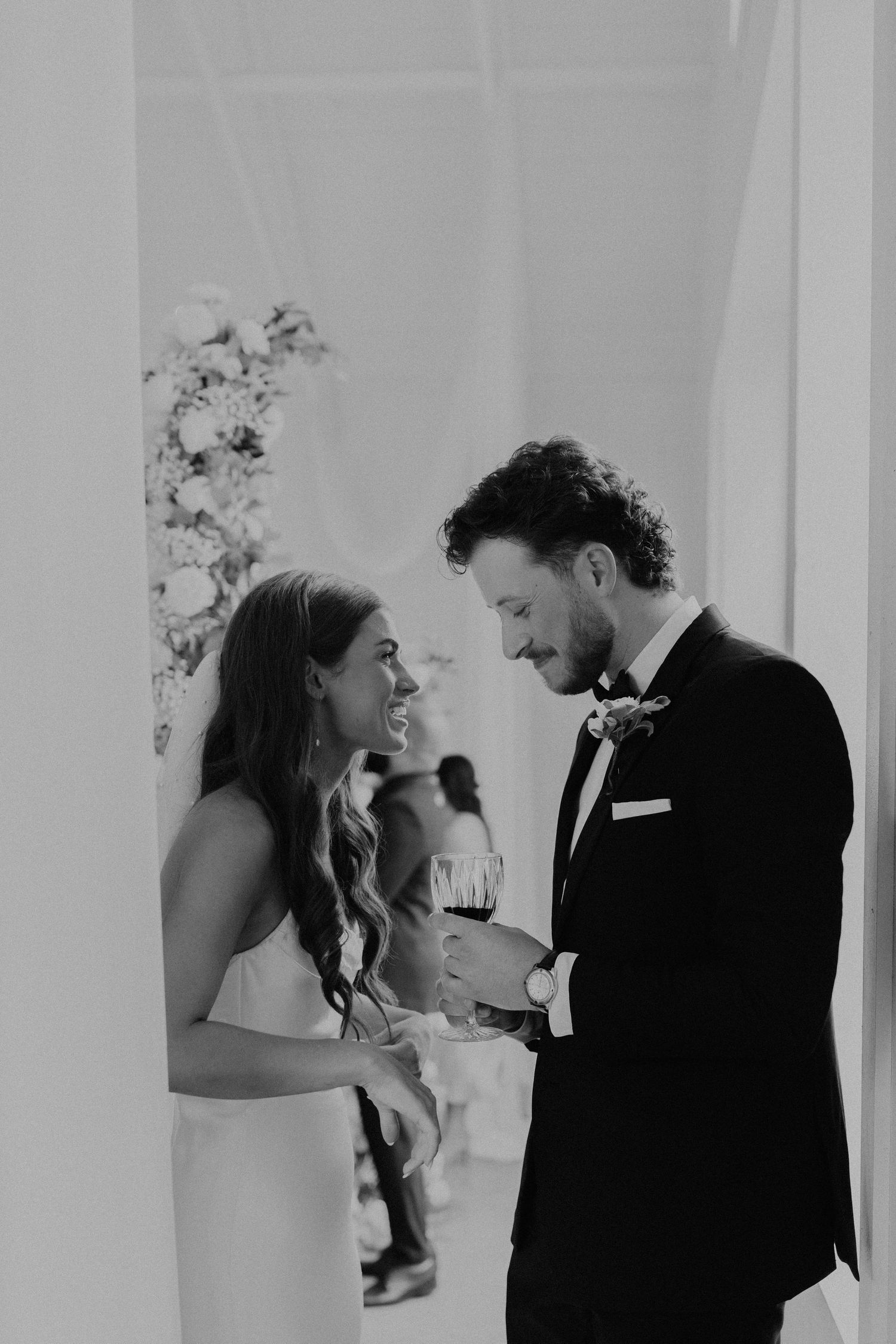 Emotional black and white sequence of couple sharing a special moment in a white room.