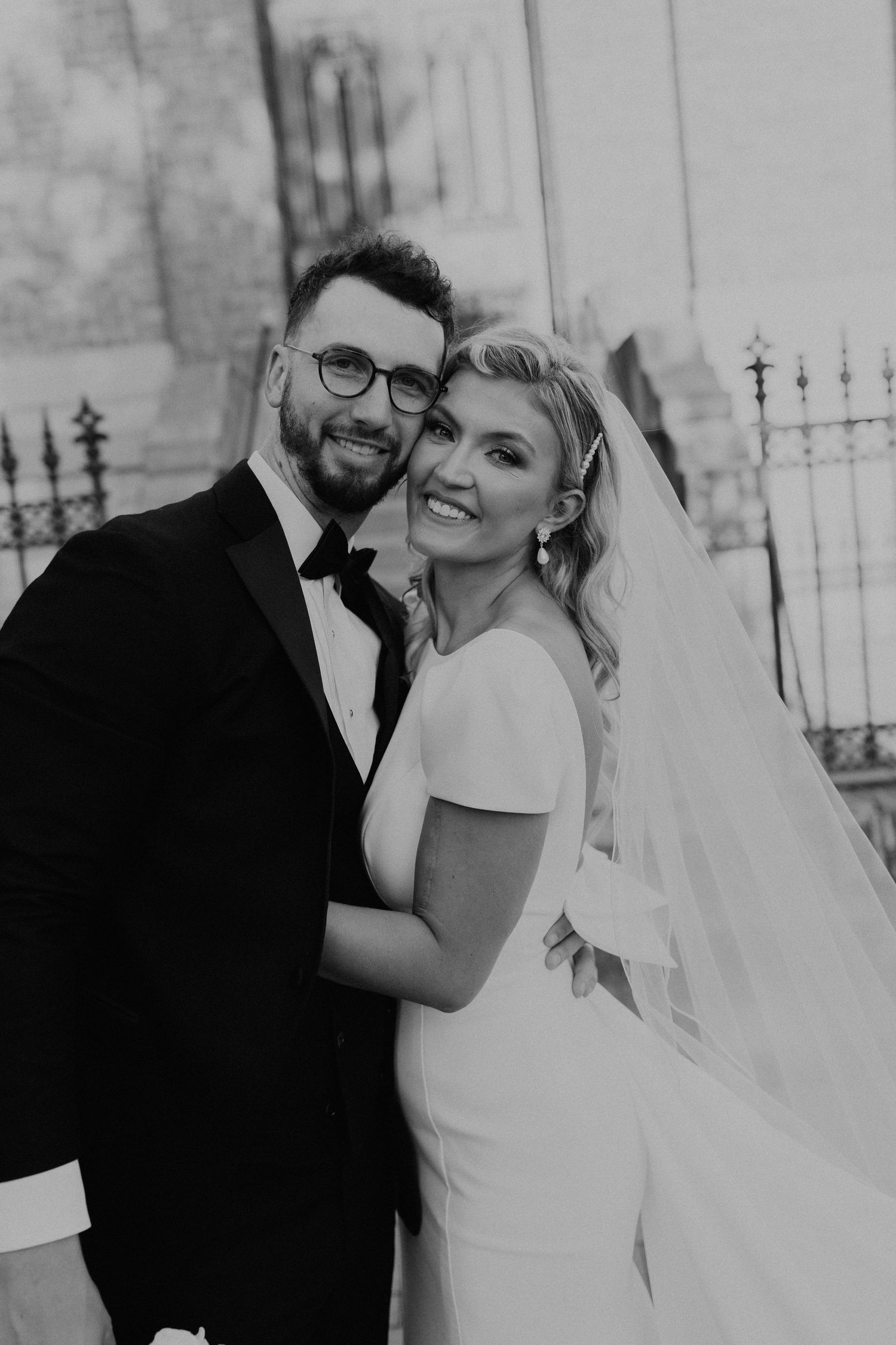 Black and white portraits of newlyweds sharing joyful moments together.