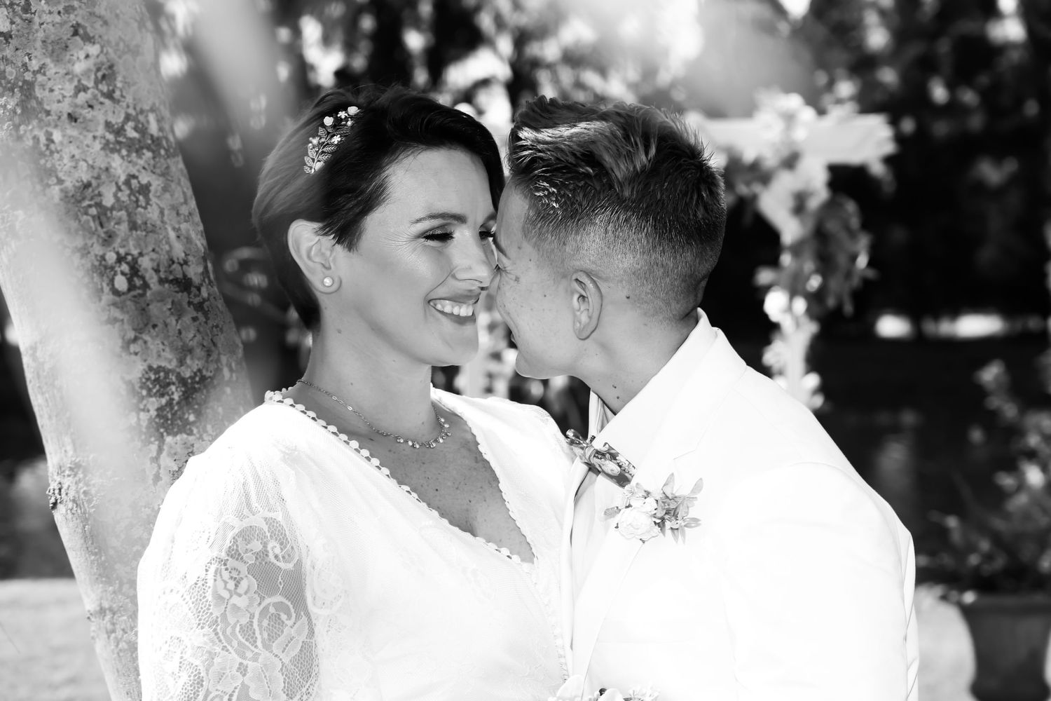 Romantic wedding photo series in black and white showing intimate moments between newlyweds.