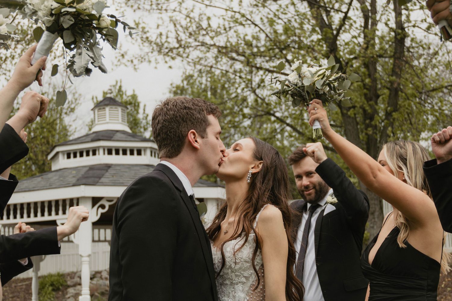 Romantic bride and groom wedding portraits in bridal party flower tunnel lehigh valley pennsylvania