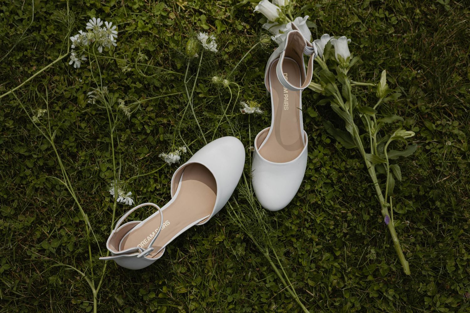 Romantic, whimsical, and cute bridal detail photos, bride's shoes in a grassy spot with loose florals, white and green, lehigh valley pa