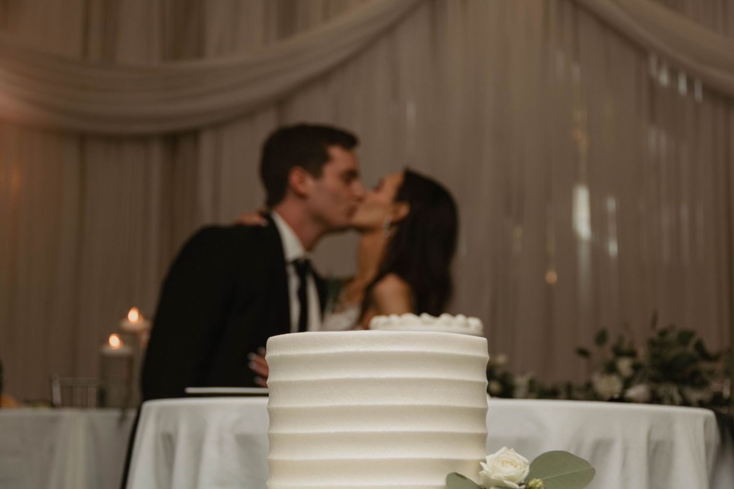 Creative romantic reception detail photos bride and groom kissing at cake cutting lehigh valley pennsylvania