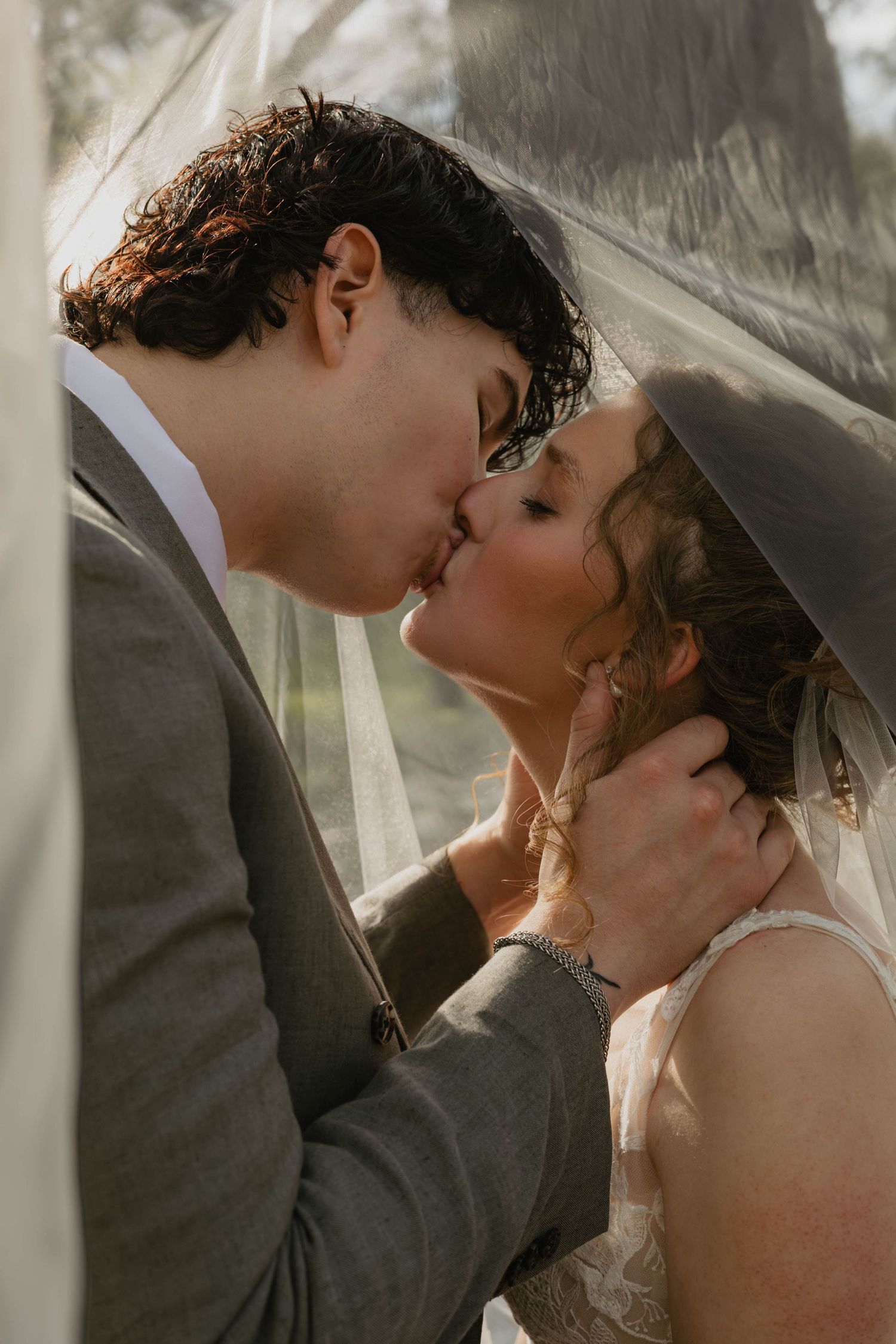 Romantic & candid wedding photography, bride and groom kissing in veil, intimate bride & groom photos, creamy skin tones, Lehigh Valley PA