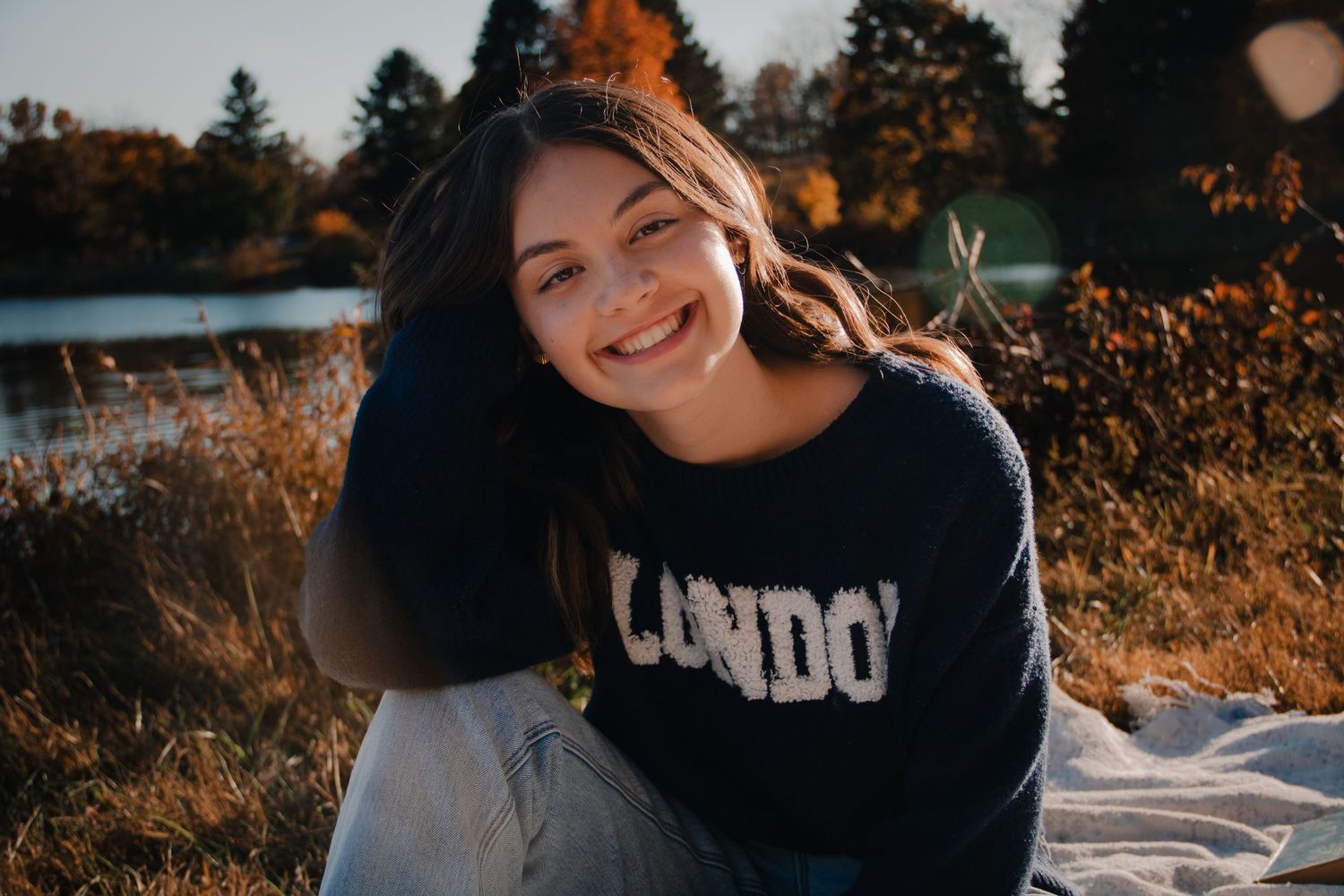 Lehigh Valley Pennsylvania Photographer individual senior photos, golden hour, lake, glowy sun, warm fall senior portraits, happy, cozy
