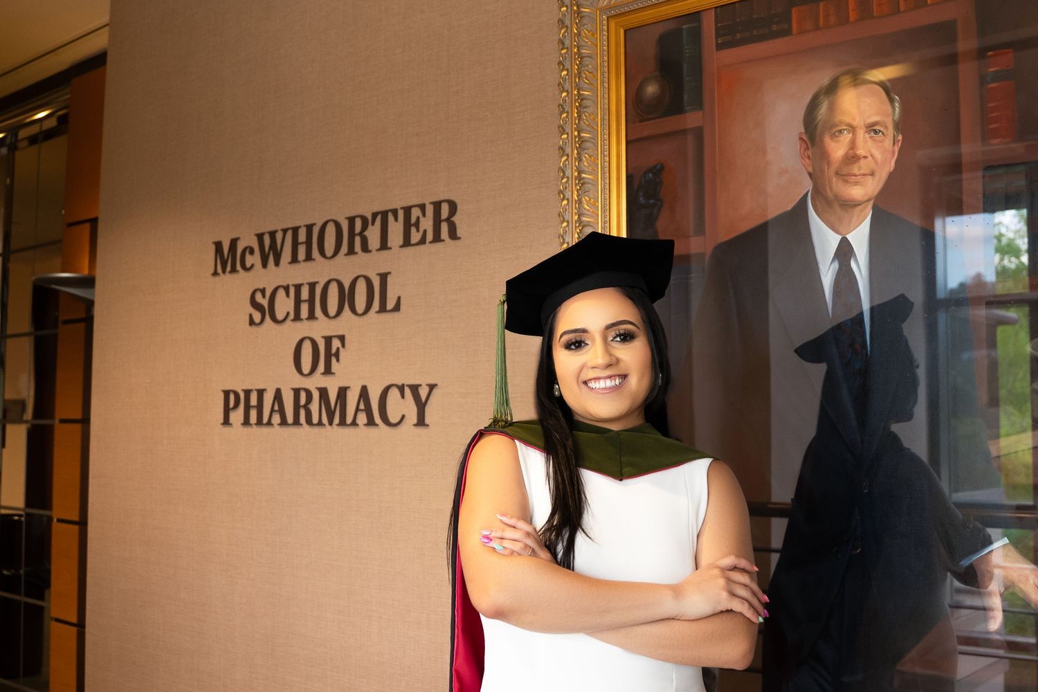 Interior hallway of McWhorter School of Pharmacy with brick walls and signage.