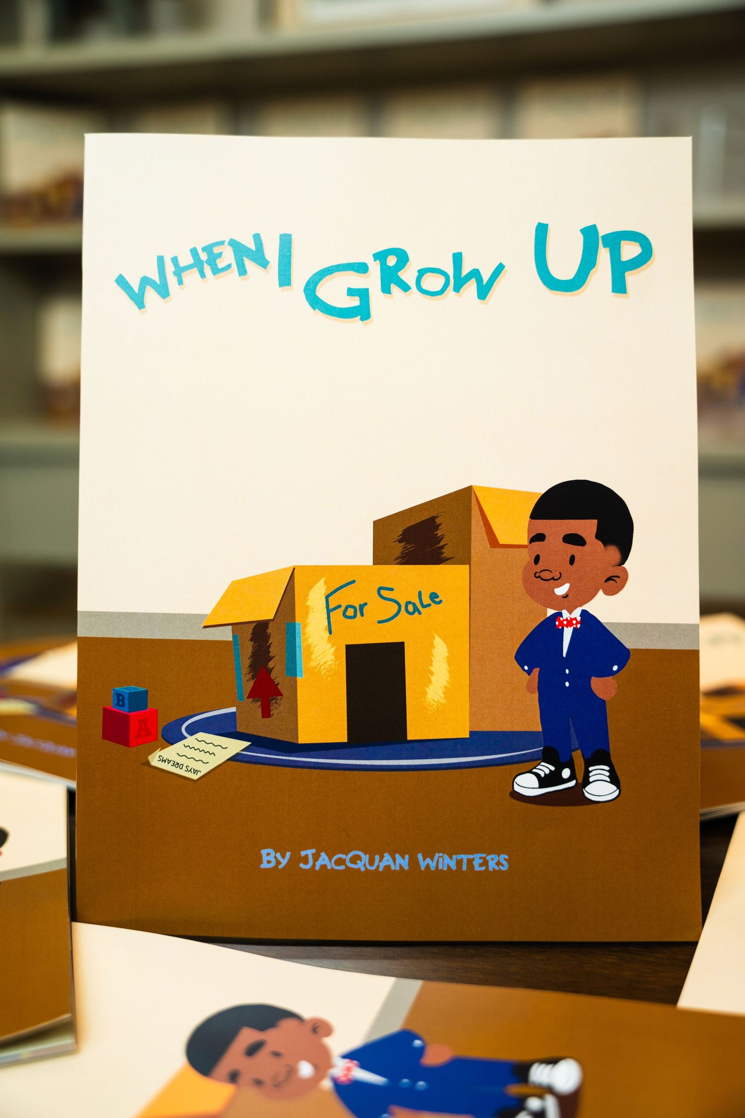 Children's book cover titled When I Grow Up featuring illustrated boy and cardboard box.