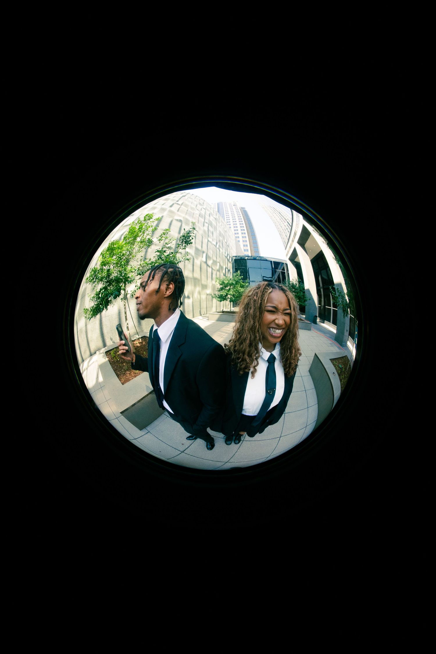 Four fisheye lens photos show people in formal attire interacting in an outdoor setting with trees visible.