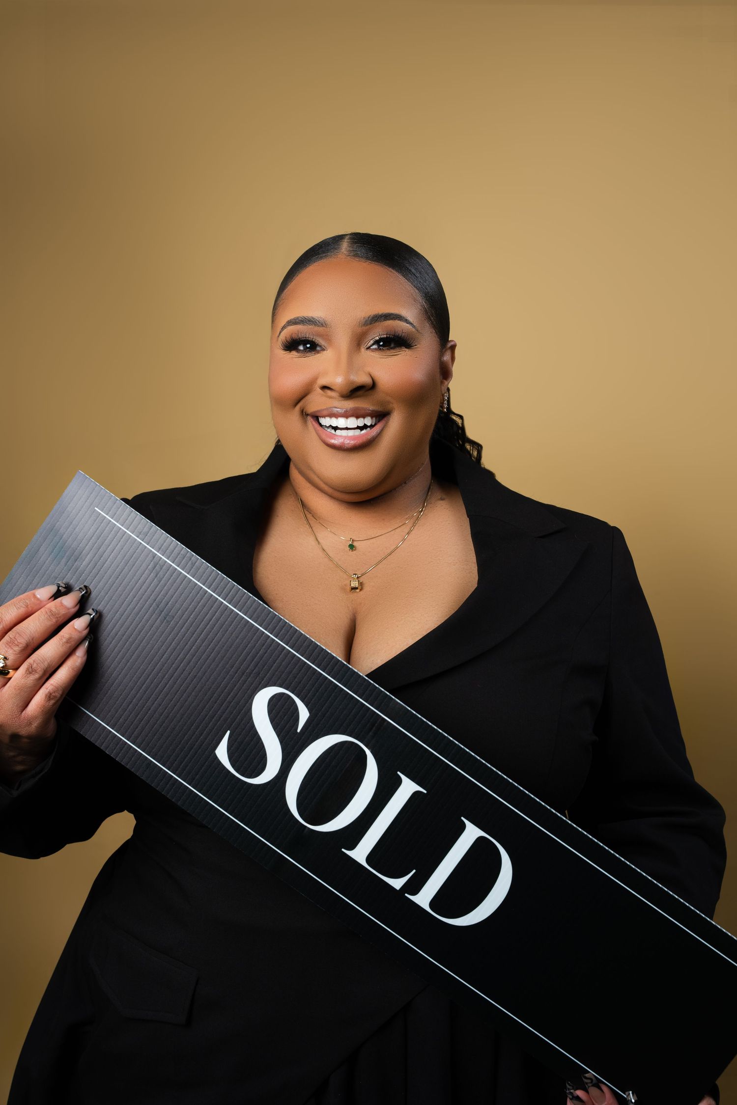 A series of photos showing a person in black holding real estate SOLD signs against a beige background.