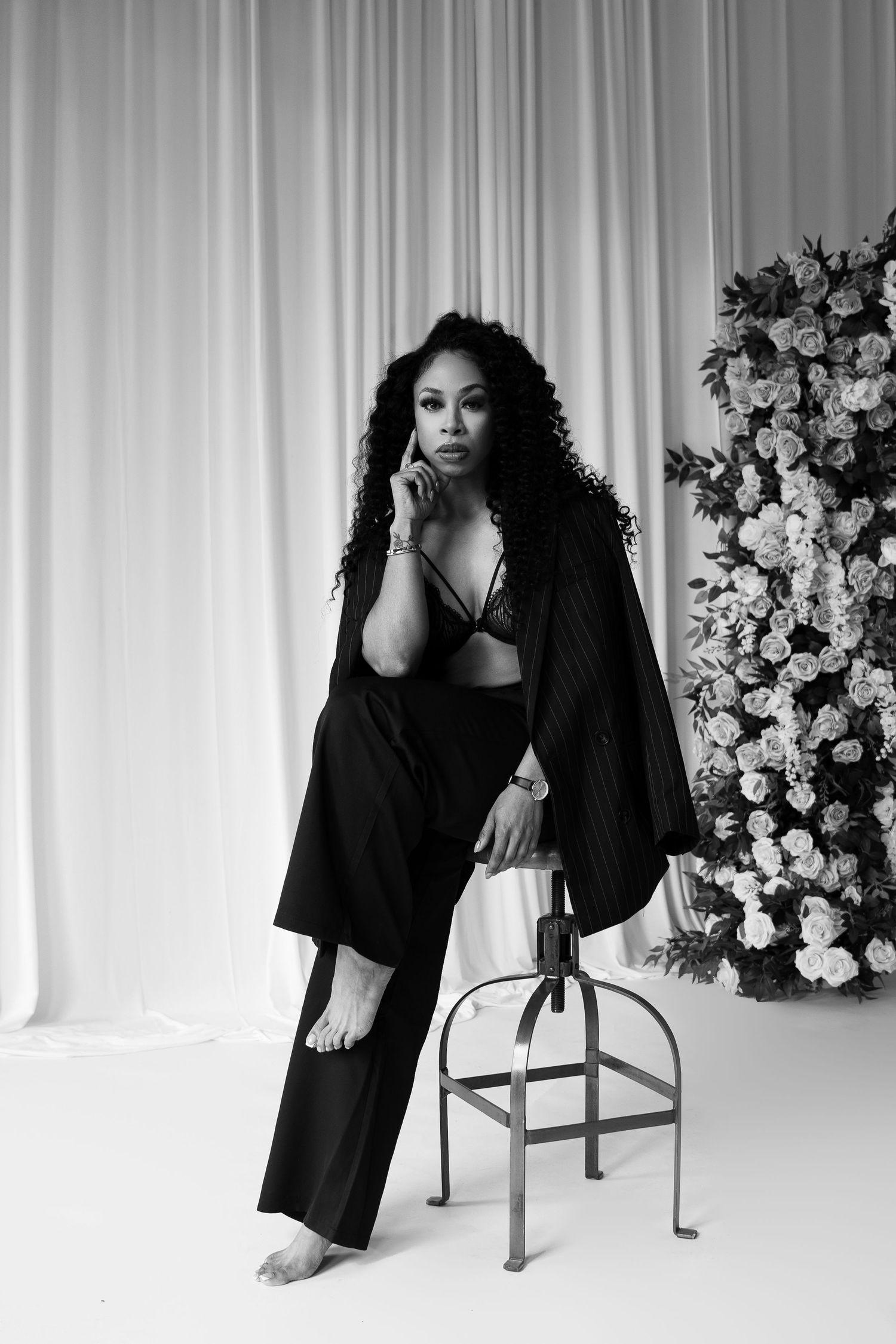 Artistic portrait series against white curtains and floral backdrop showing graceful poses.
