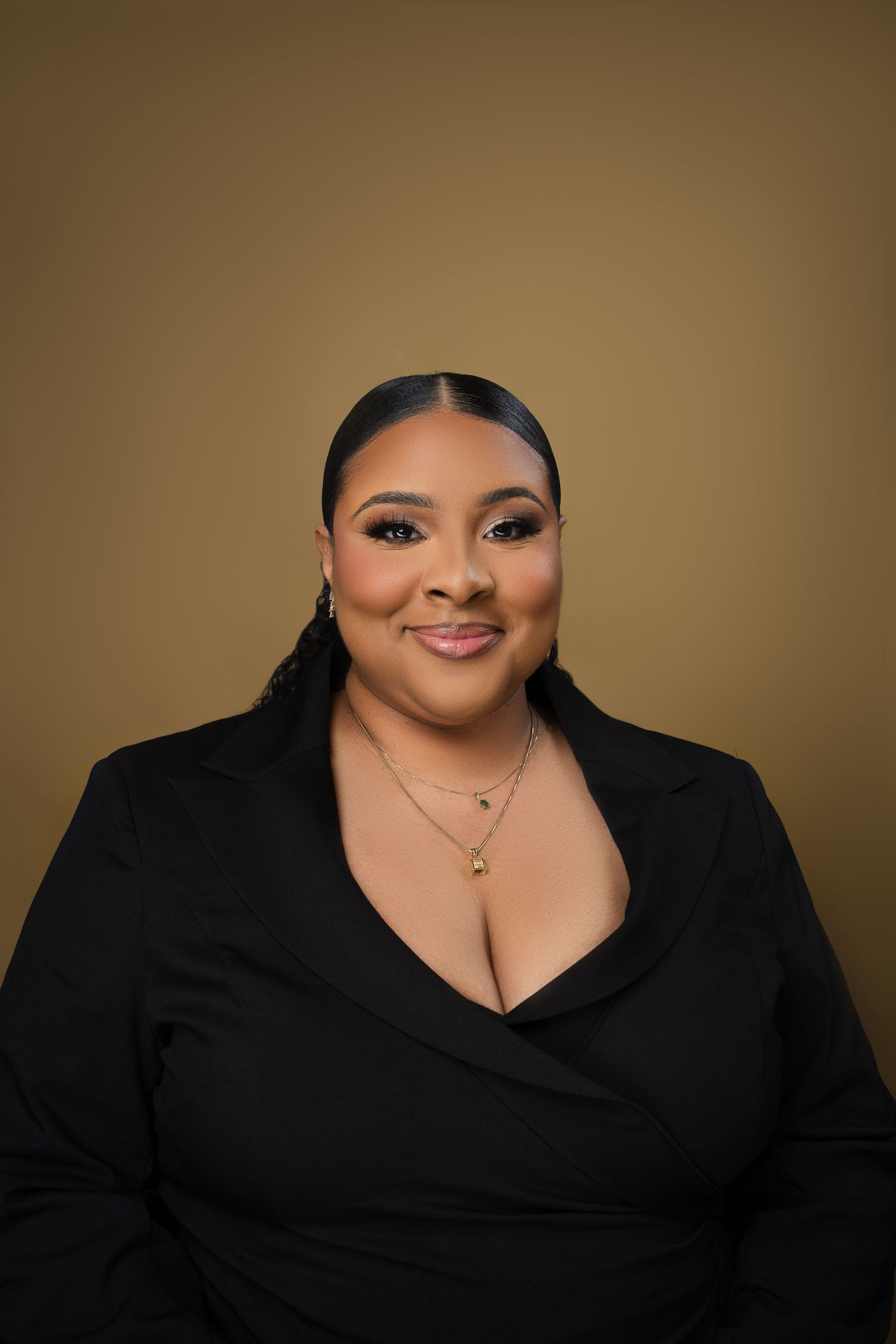 A series of professional headshots showing a person in a black top against a brown backdrop.