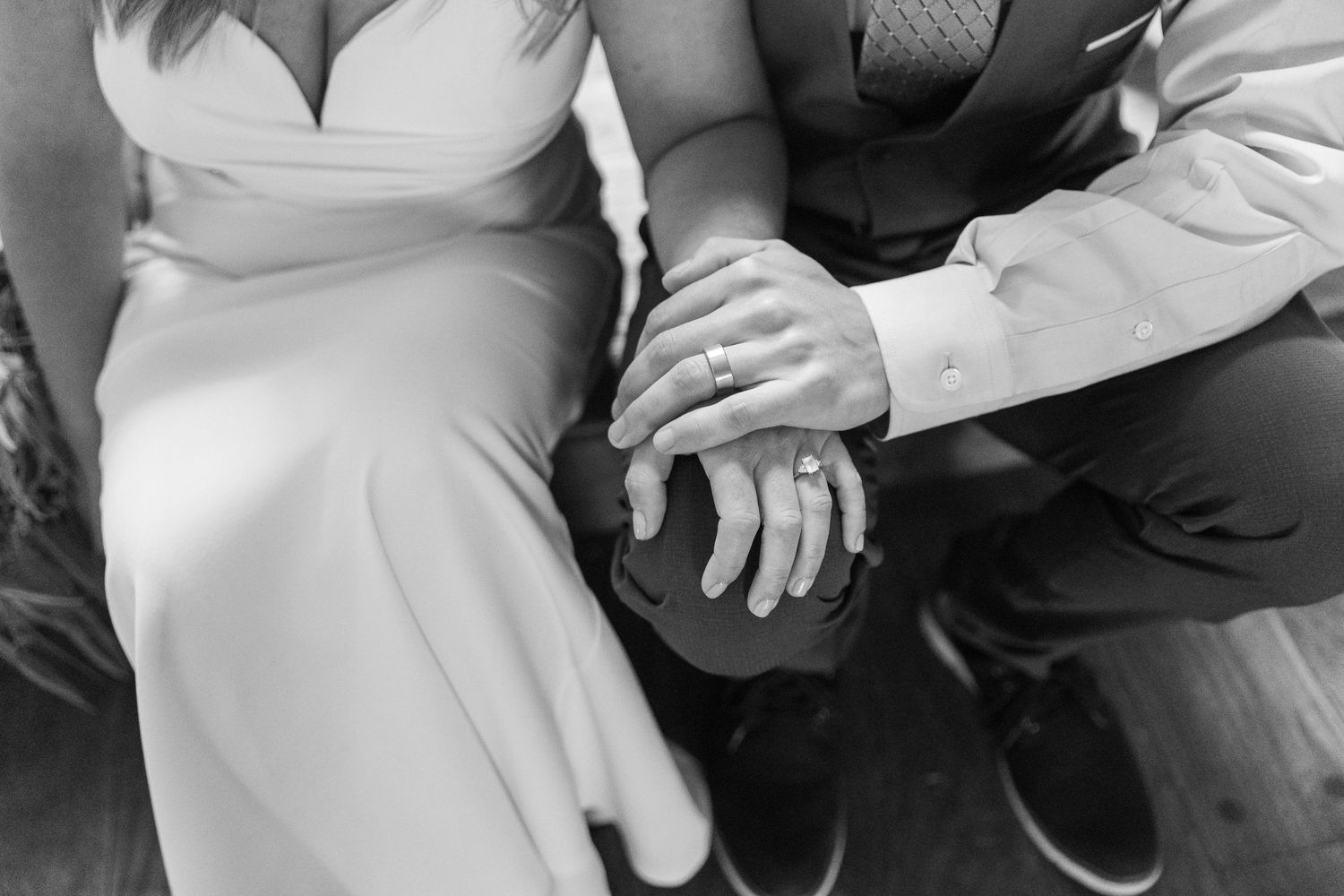 Black and white close-up details of wedding attire and accessories.