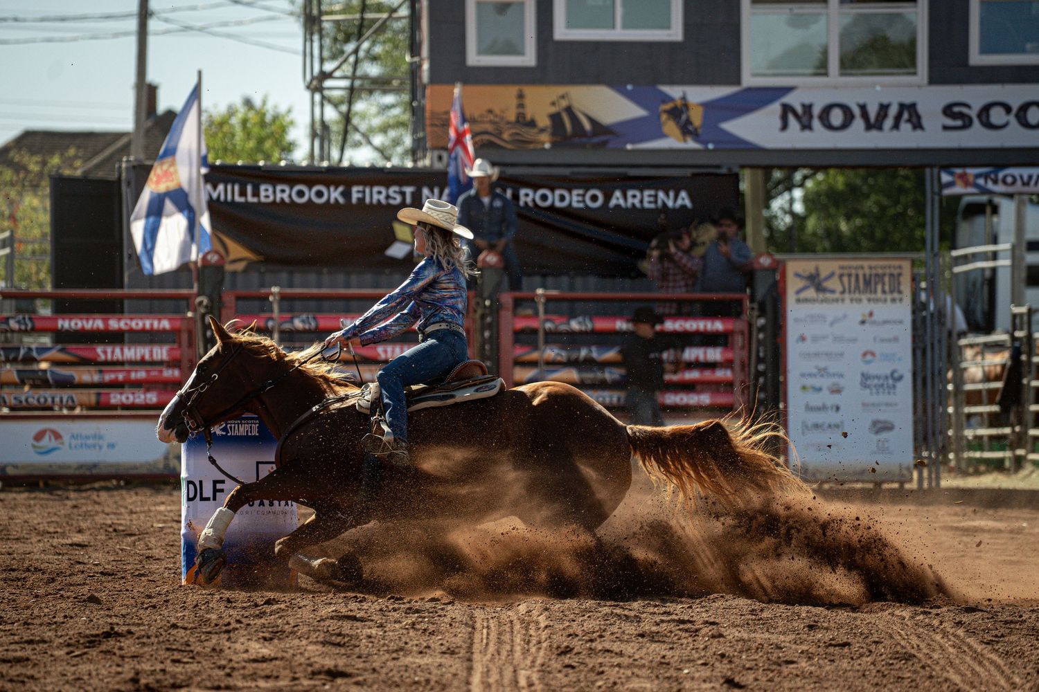 Bull rider being thrown from bucking bull at rodeo competition.