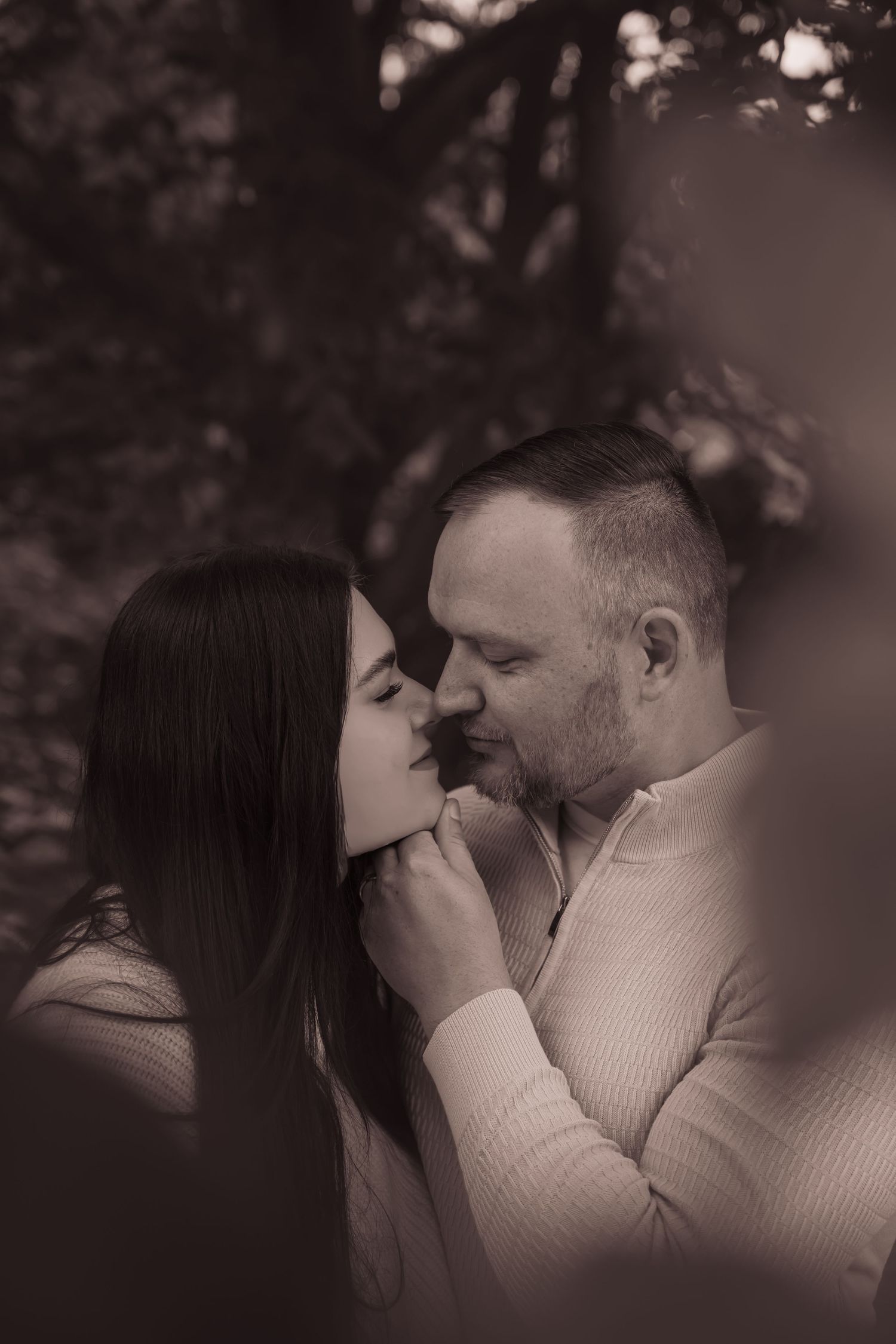 A romantic black and white photo sequence shows a couple sharing intimate moments in soft lighting.