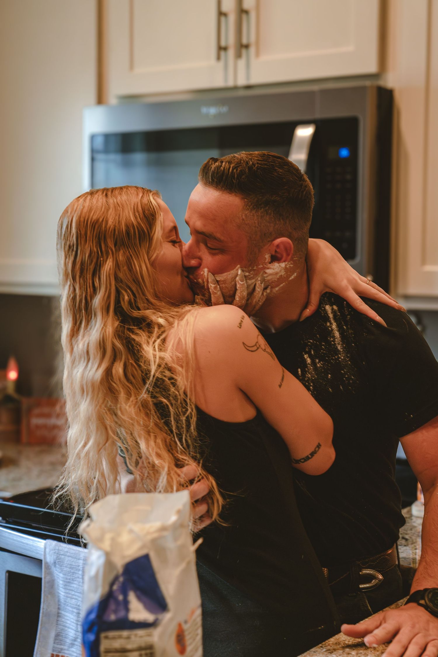 Playful kitchen scene with flour-covered moments.