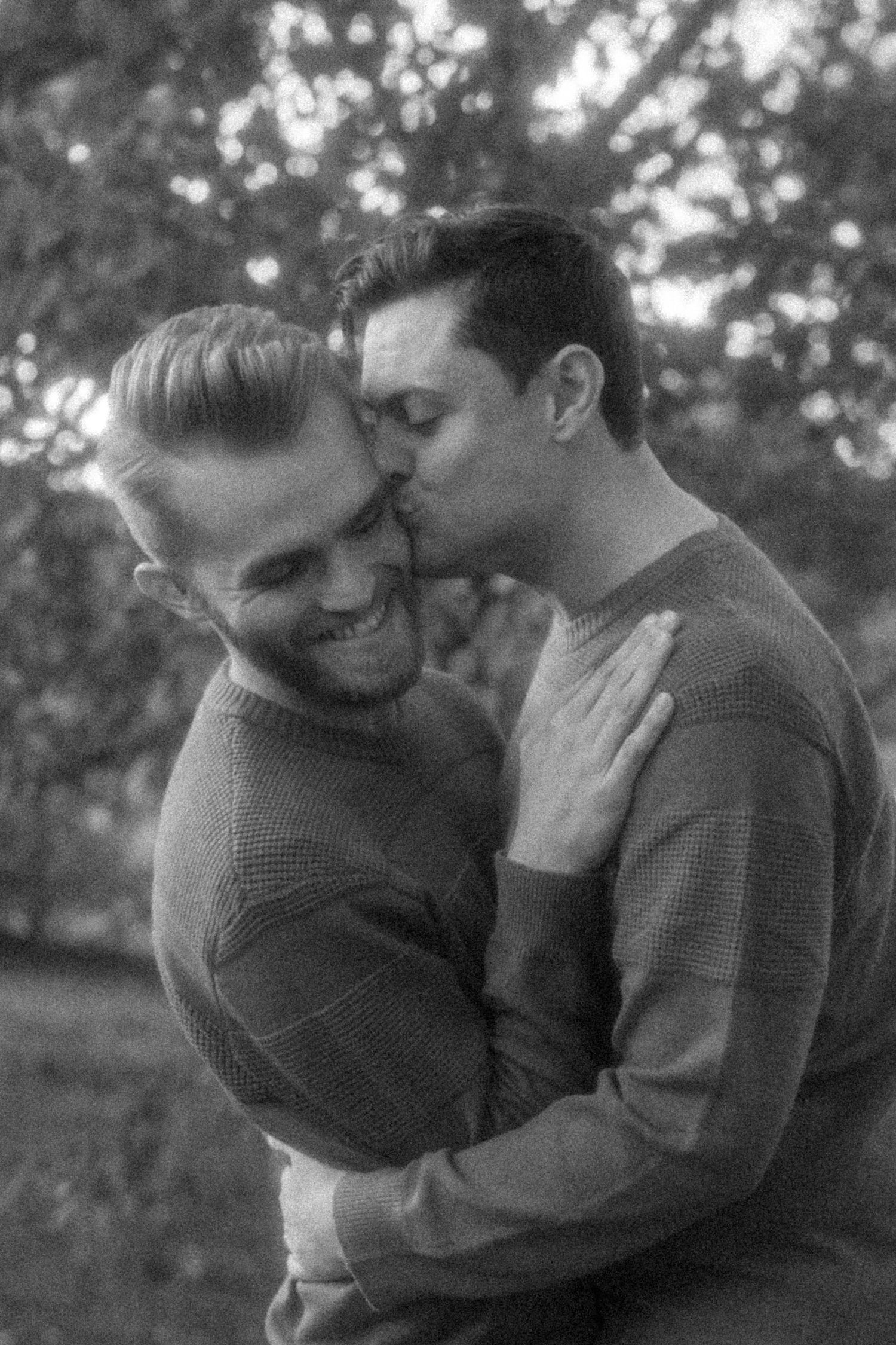 Intimate black and white portrait sequence showing tender moments between two people.